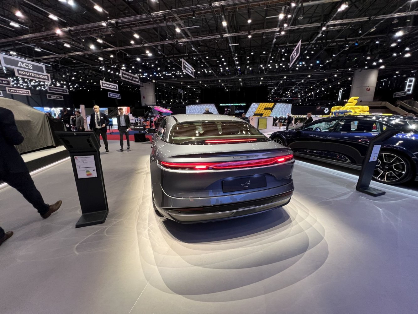 Rear view of electric sedan with continuous LED taillights