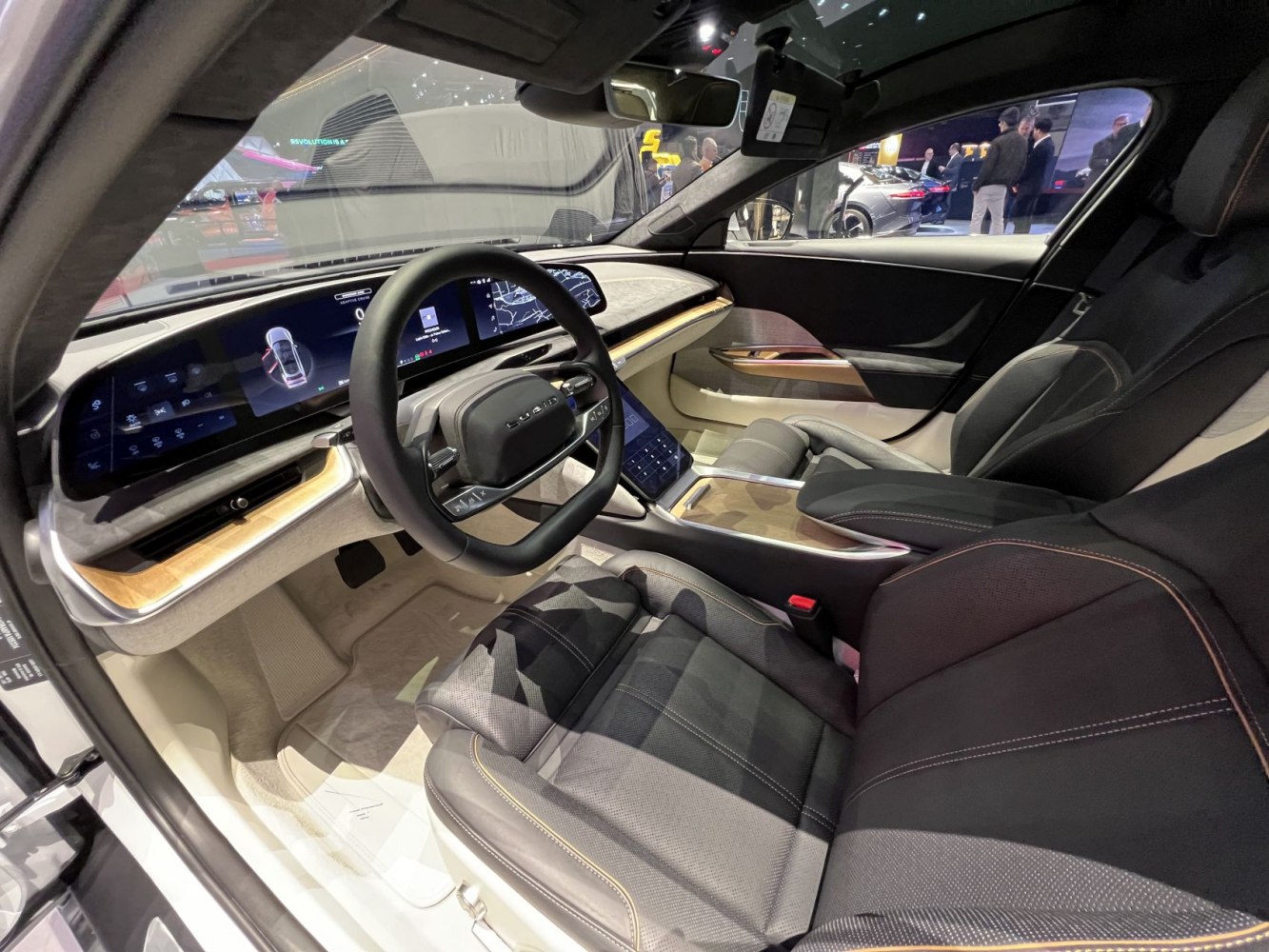 High-tech digital dashboard and luxury steering wheel in a modern electric car interior
