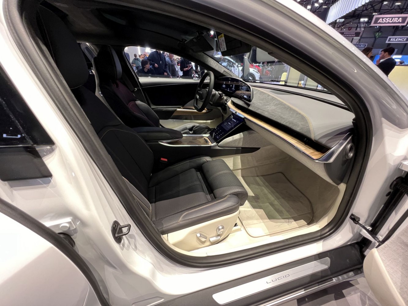 Modern electric vehicle interior with digital displays and leather seats