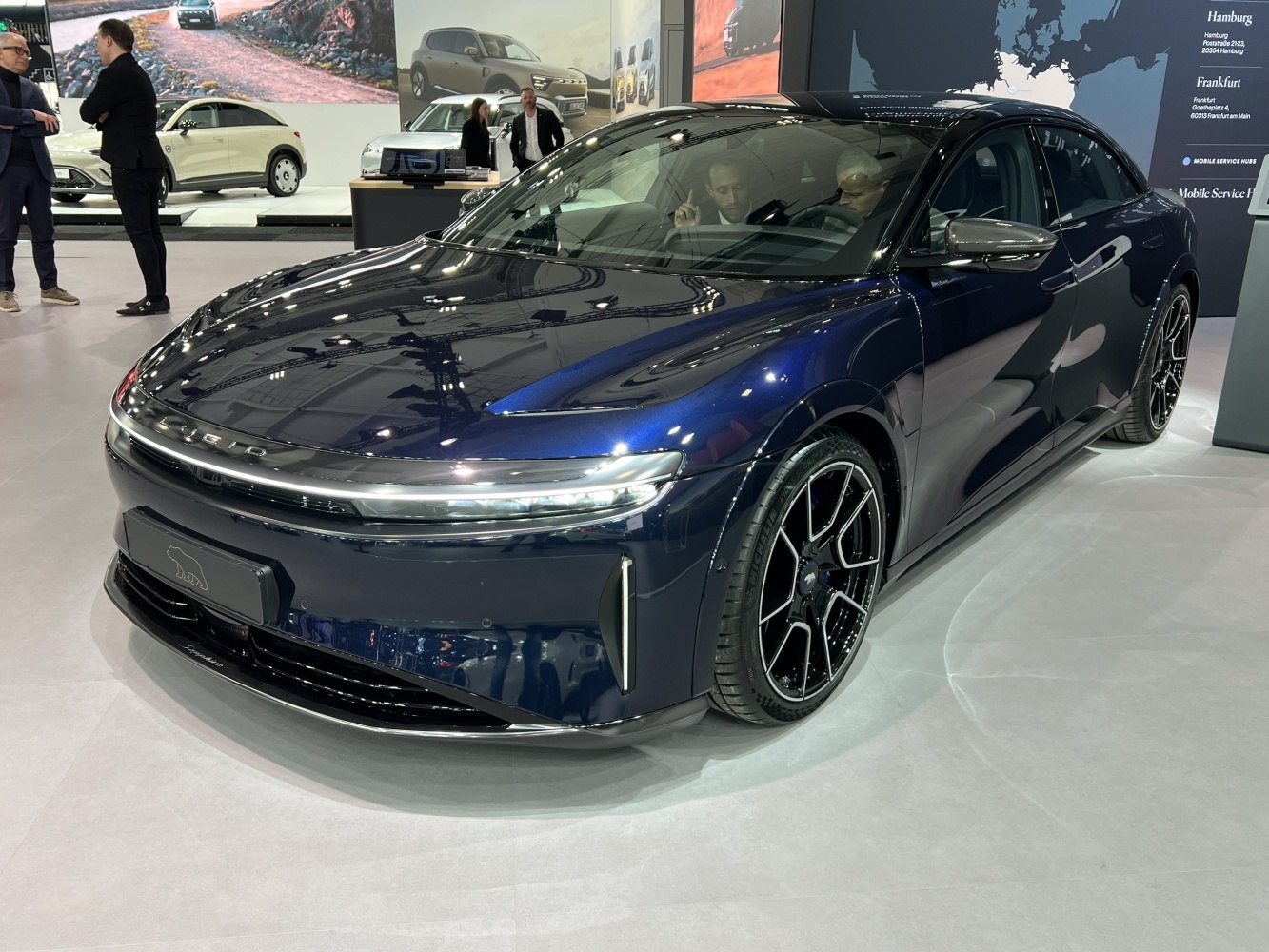 Sleek electric sedan with LED headlights and aerodynamic front design