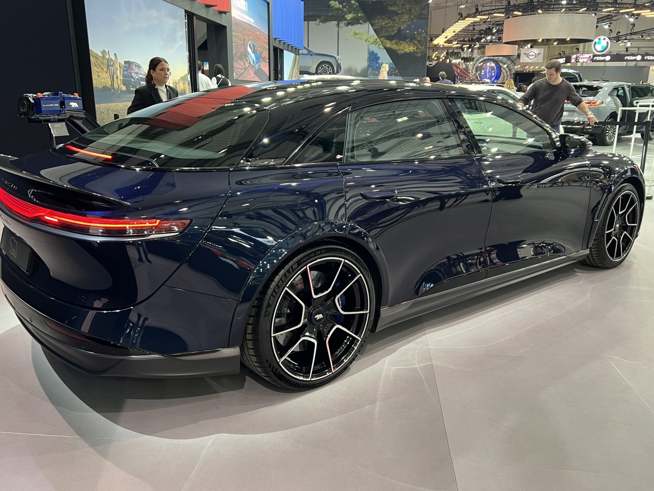High-angle rear and side view with sleek taillights and alloy wheels