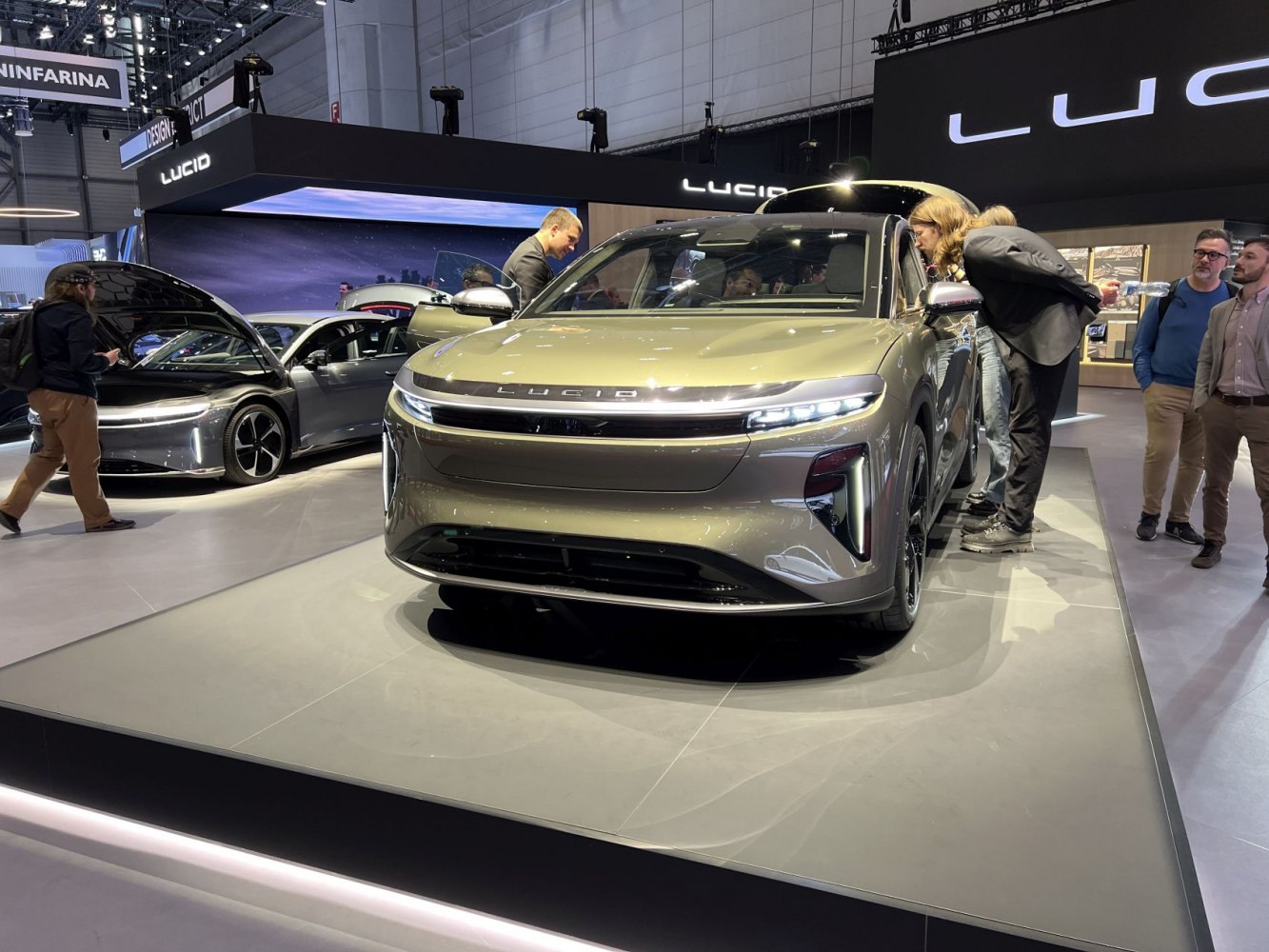 Front view of a modern electric SUV with sleek LED headlights and aerodynamic design