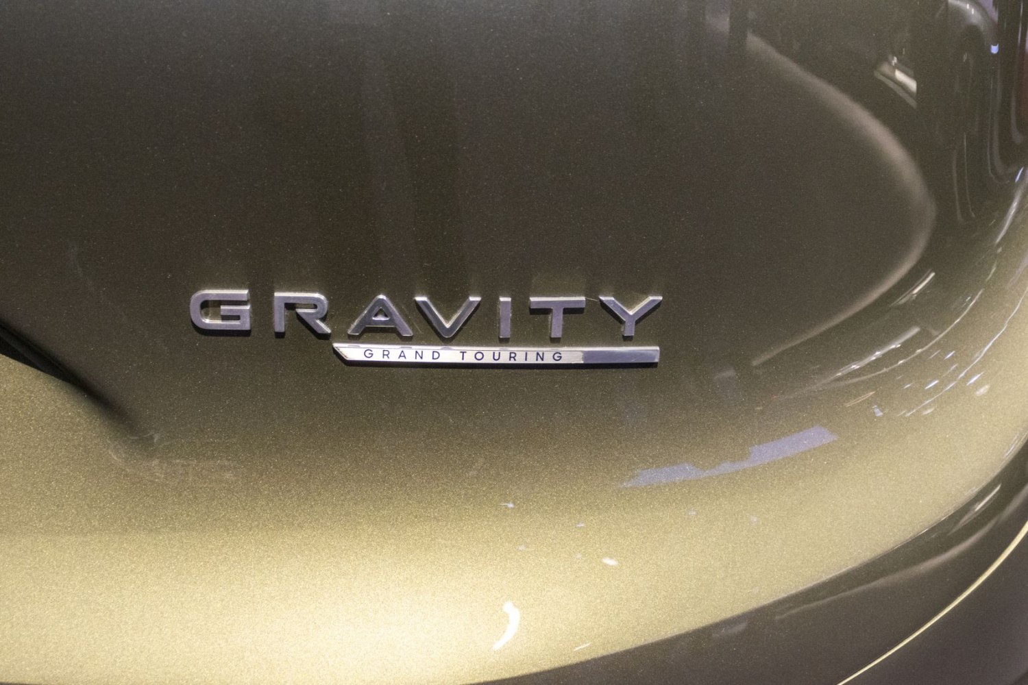 Close-up of an elegant Lucid Gravity Grand Touring emblem.