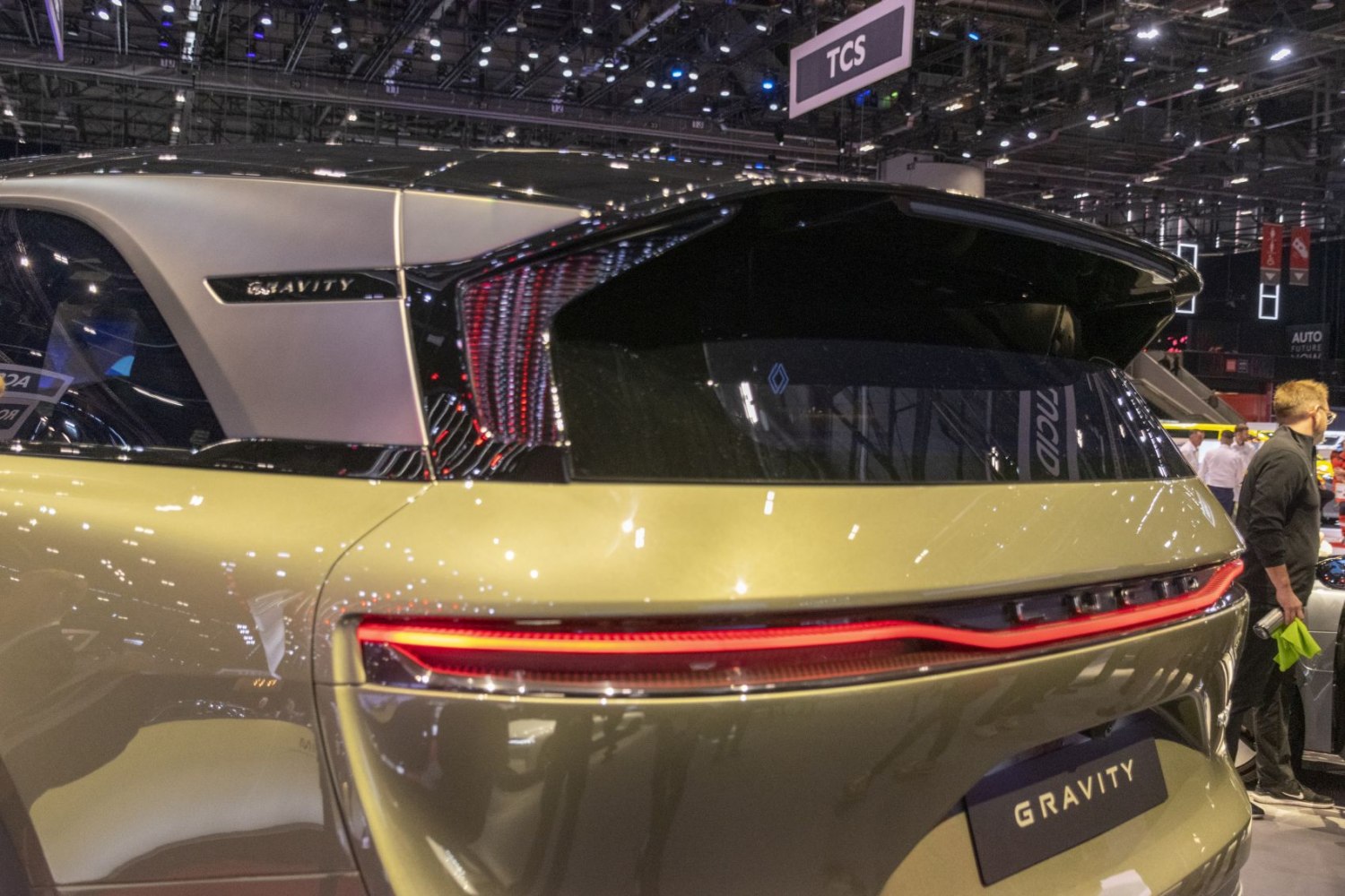Sleek rear design with distinctive tail light and rear window shape.