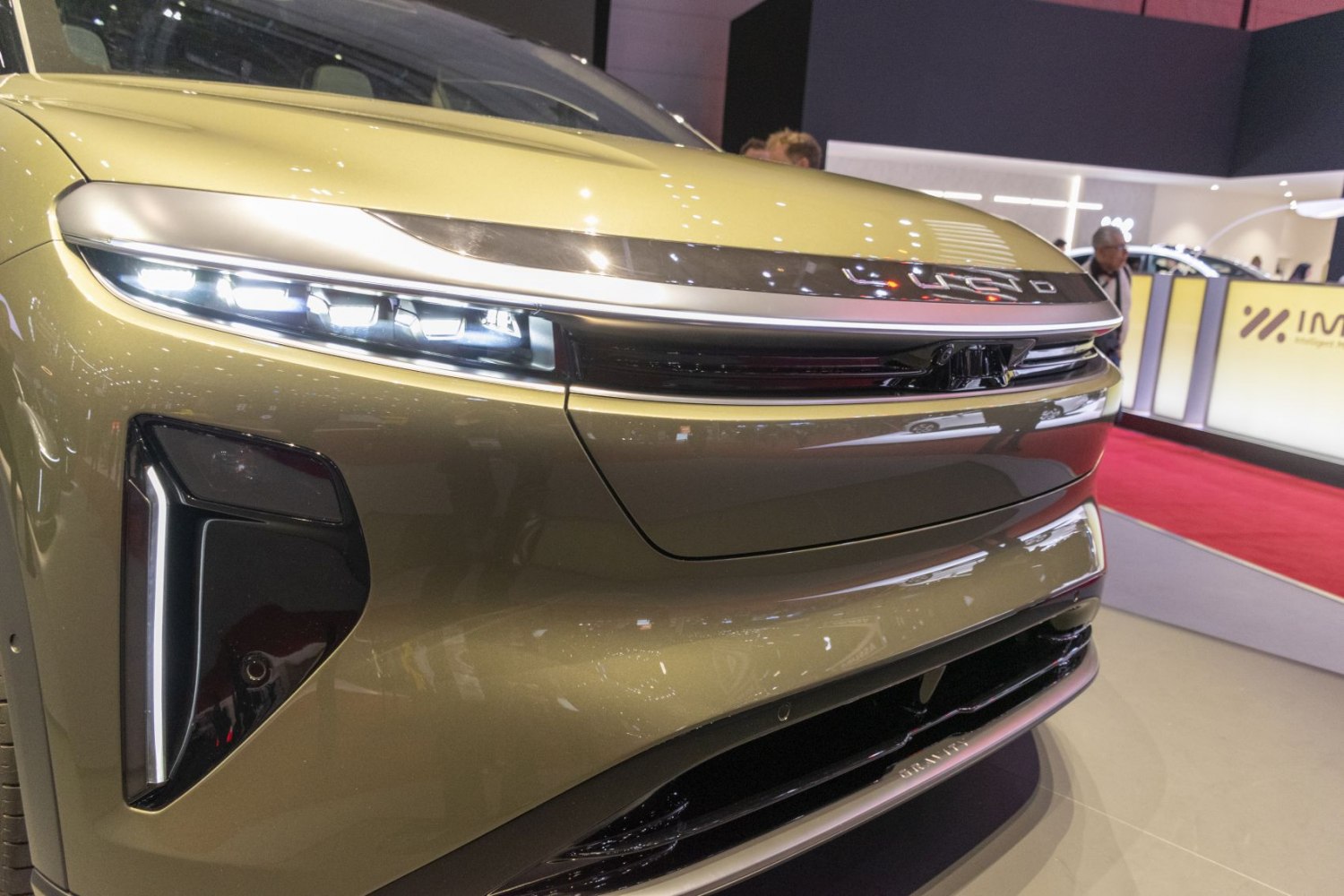 Front view of luxury electric SUV with sleek LED headlights and aerodynamic design