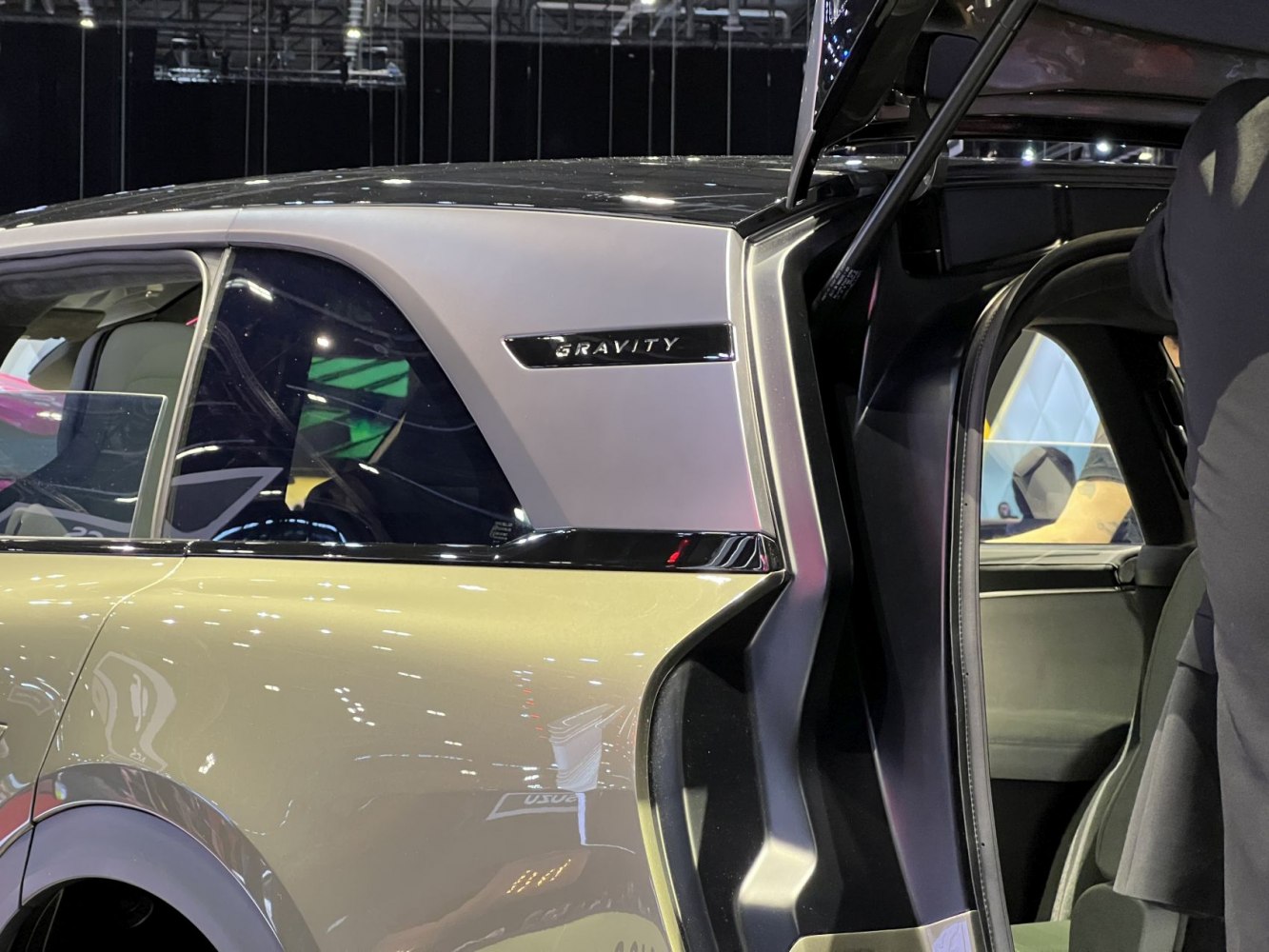 Side panel badge and open rear falcon wing door
