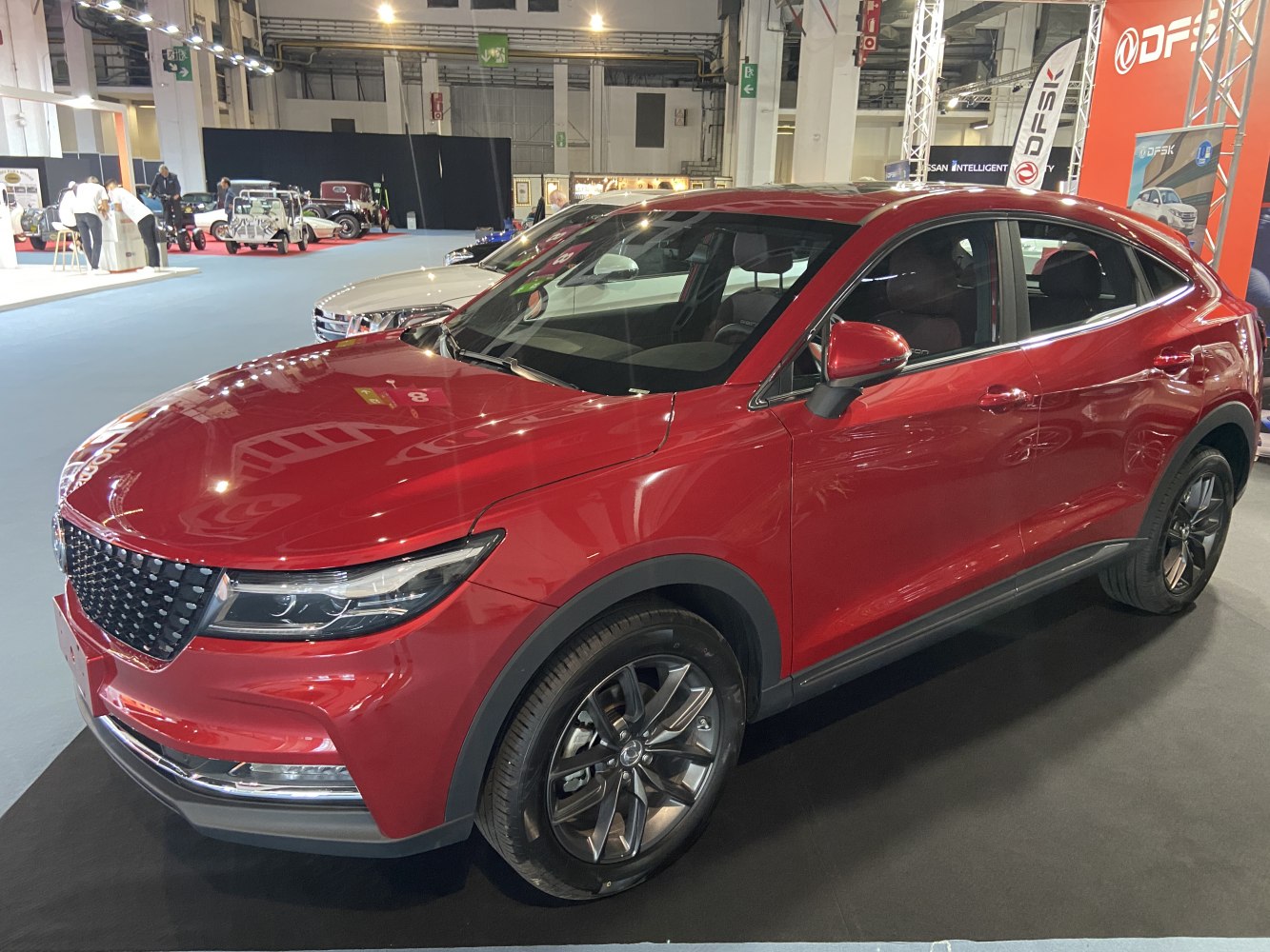 Red SUV with honeycomb grille and LED headlights