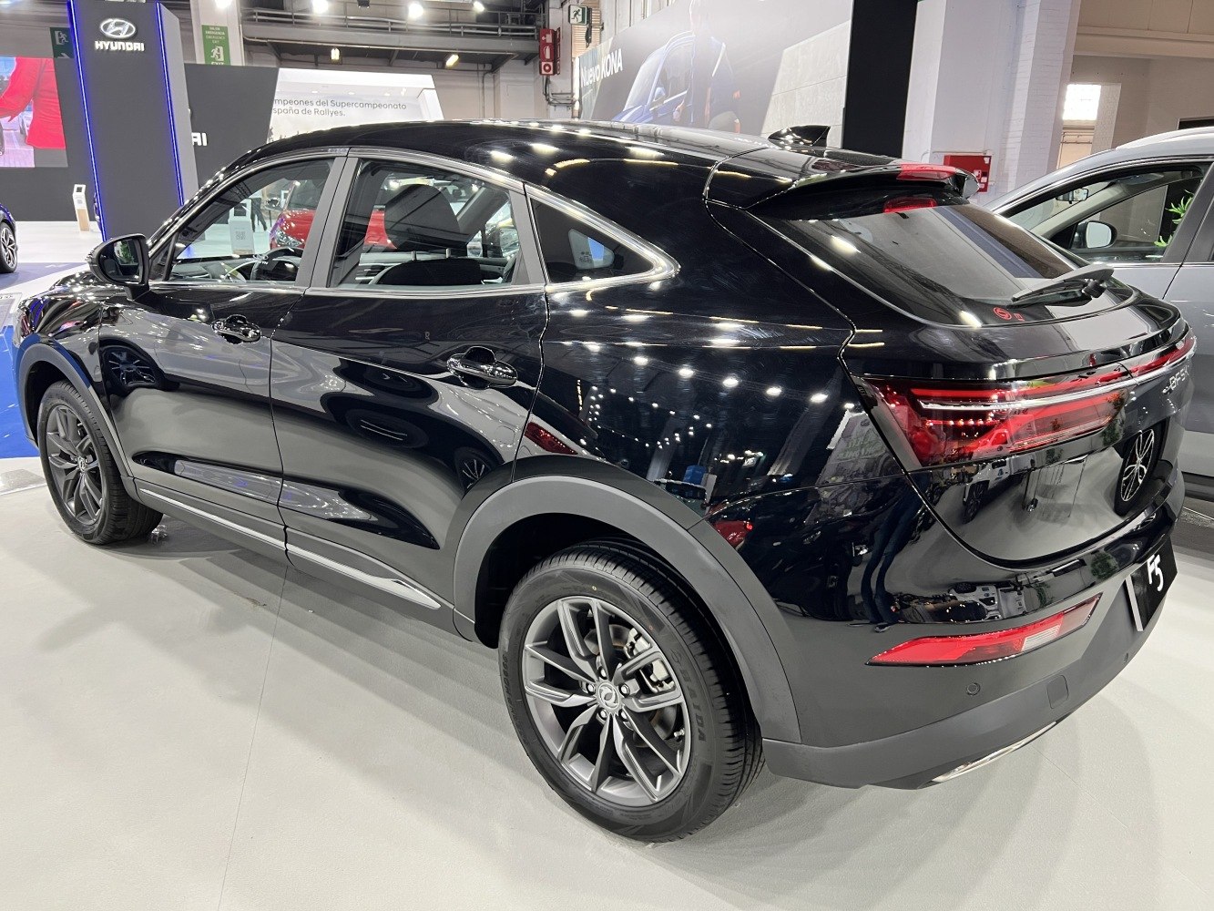 Rear and side profile of a sleek compact SUV with alloy wheels and LED taillights