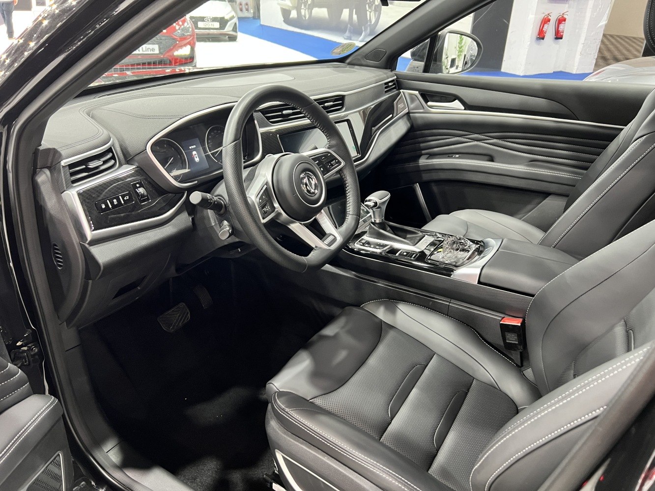 Modern car interior with dashboard and steering wheel design