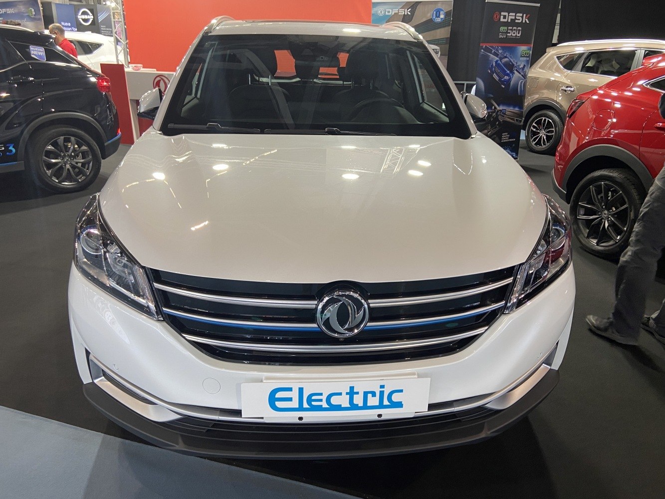 Electric vehicle front with chrome grille and LED headlights
