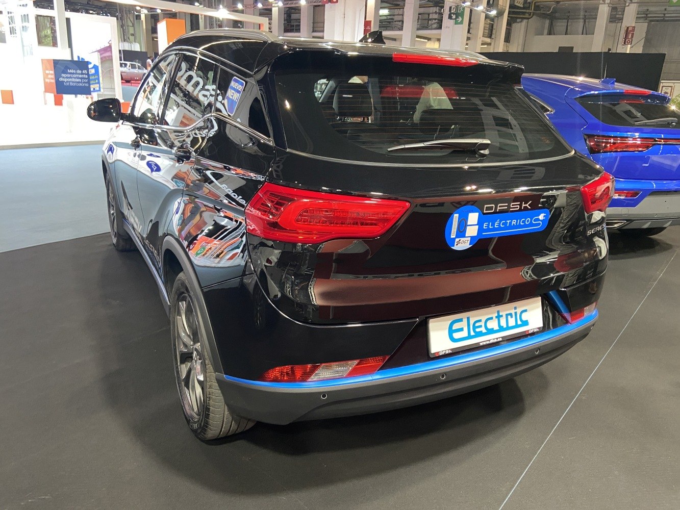 Rear view of modern electric SUV with distinct taillight design and eco-friendly badge