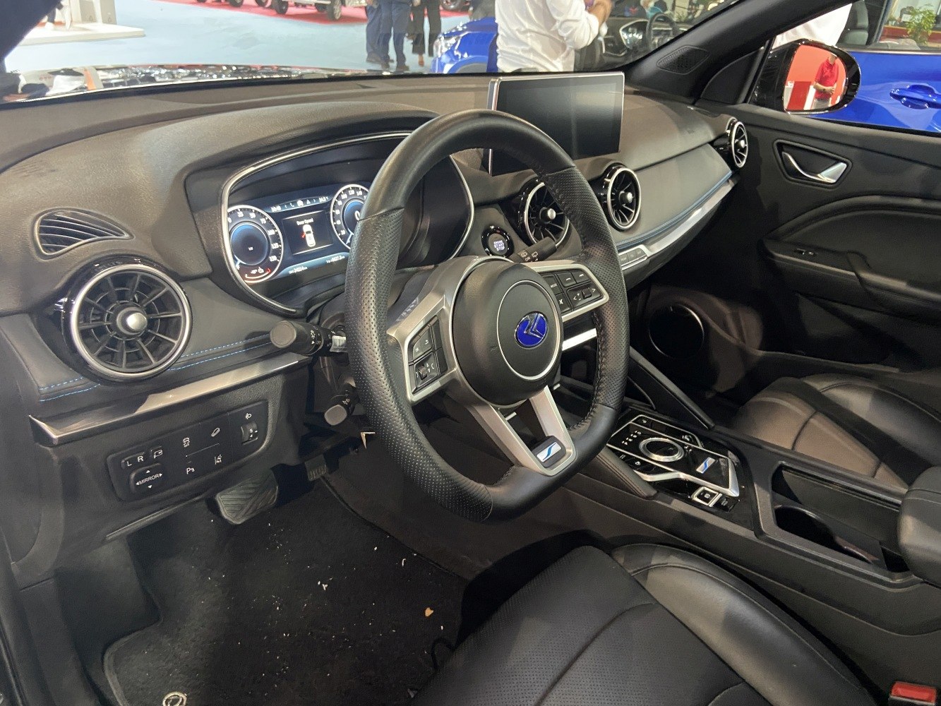 Digital instrument cluster and modern infotainment display in car interior
