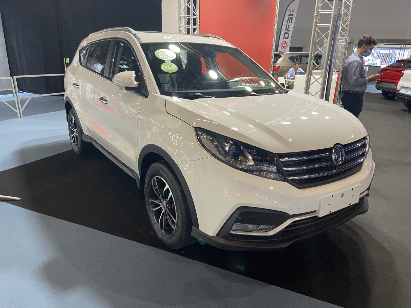 White modern SUV front three-quarter view with GLP sticker on windshield