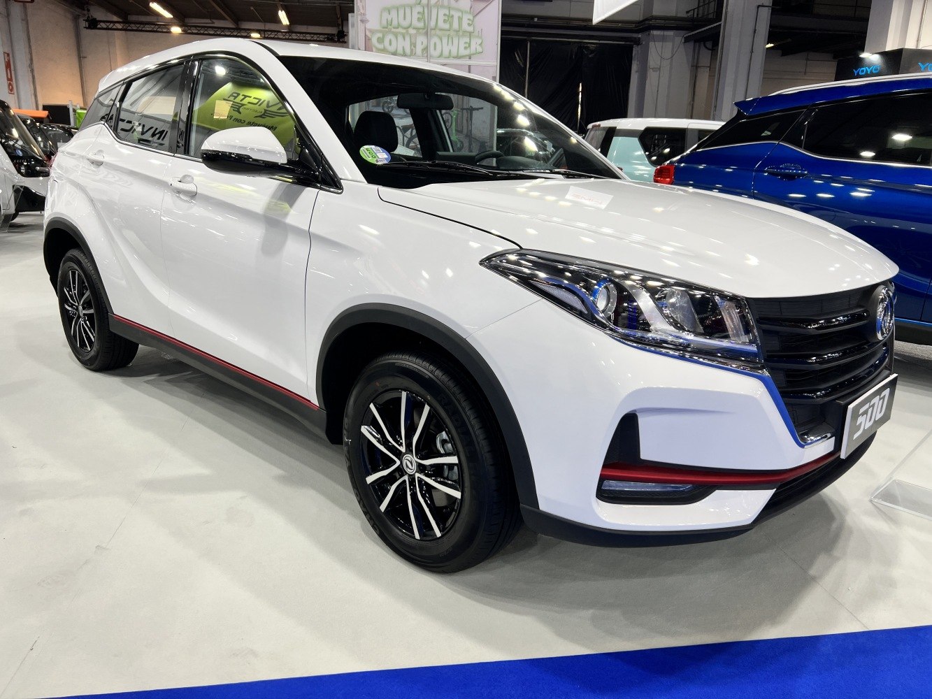 Front and side view with modern headlights and alloy wheels.