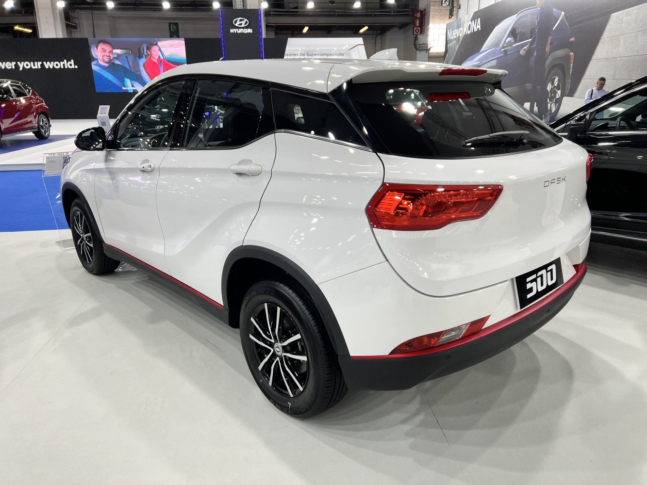 Rear side view of a modern SUV with distinct taillights and alloy wheels
