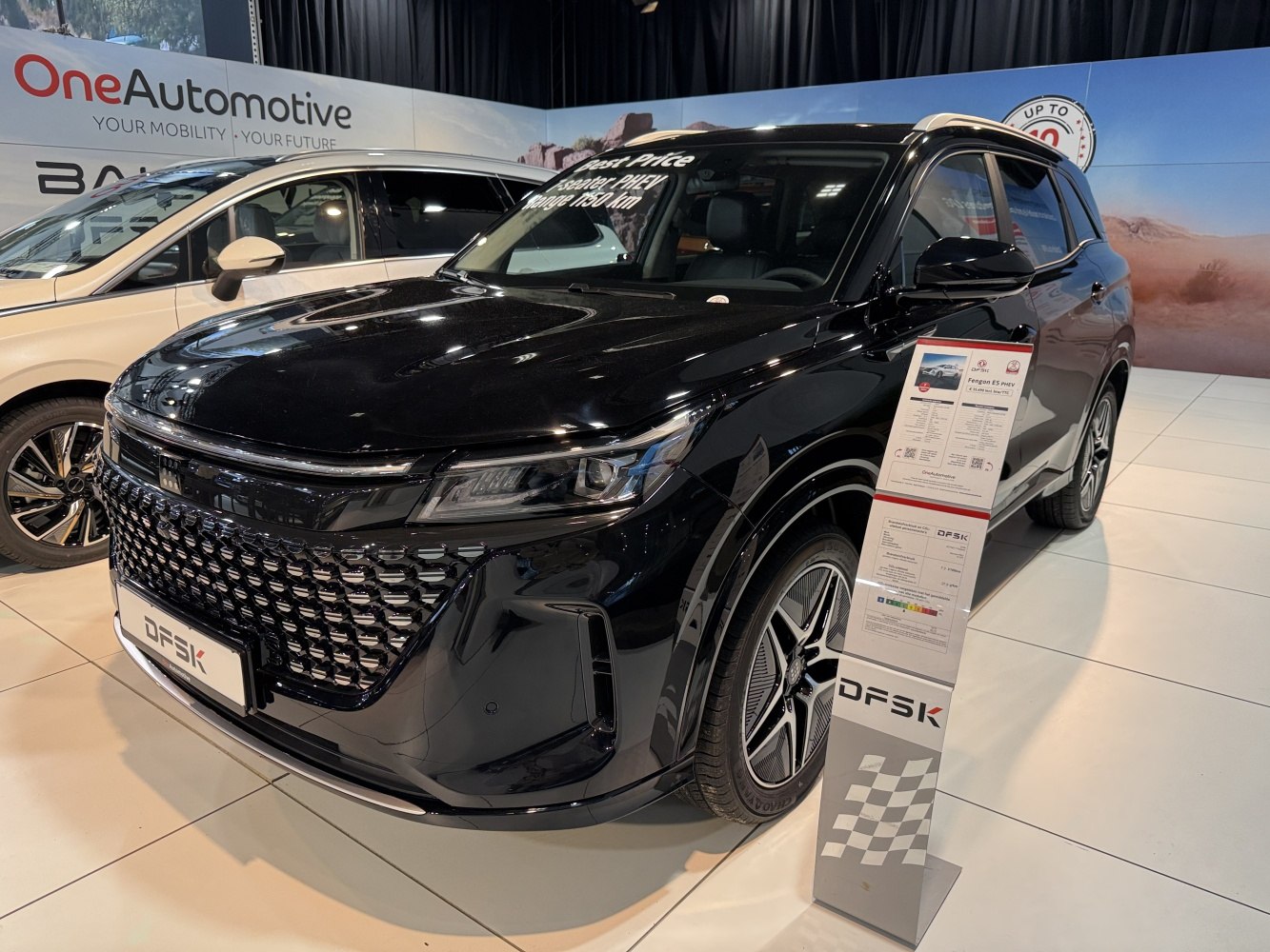 Distinctive large front grille and sleek LED headlights with modern wheels.