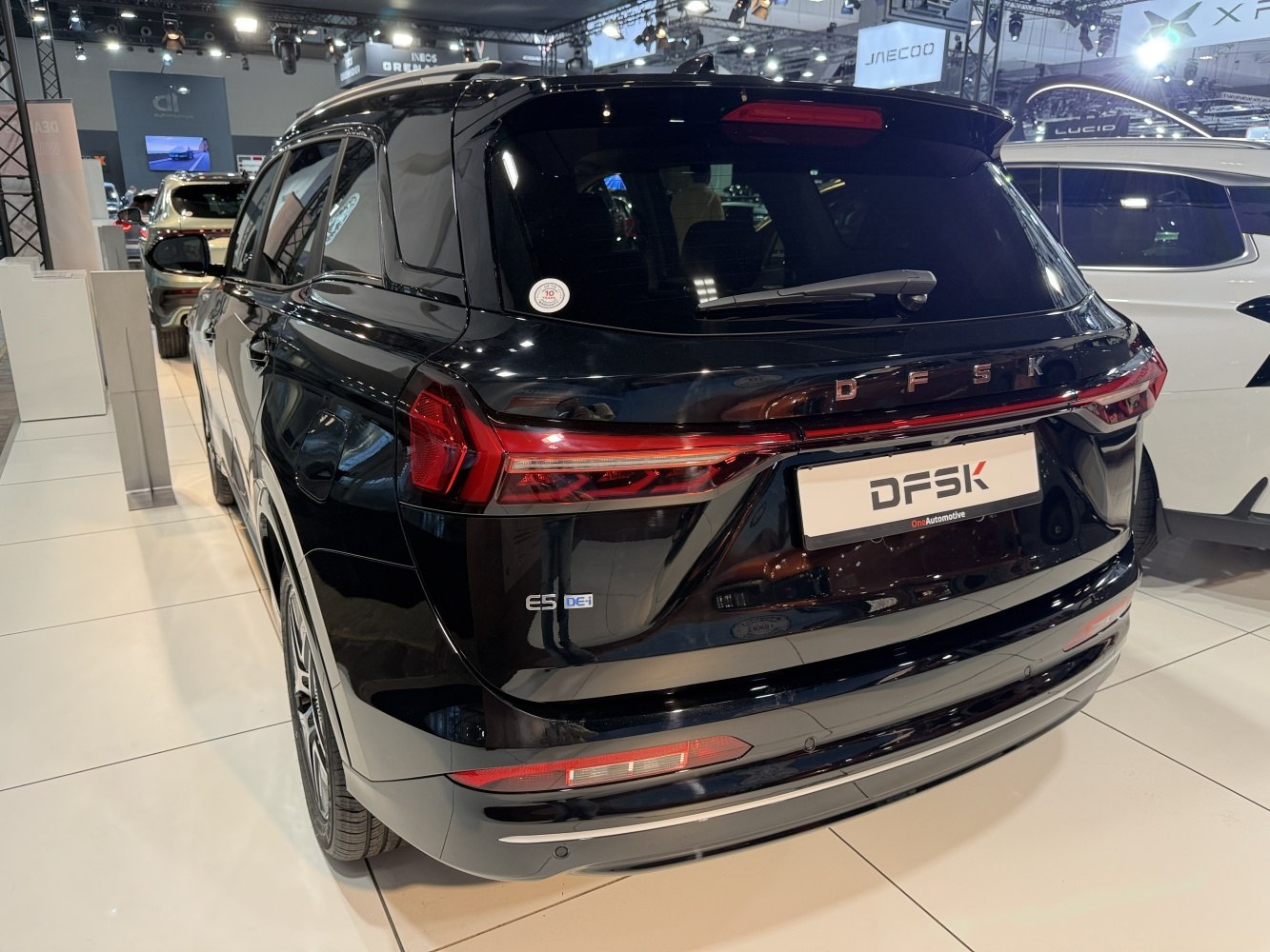 Rear view of an electric SUV with LED taillights and black glossy finish