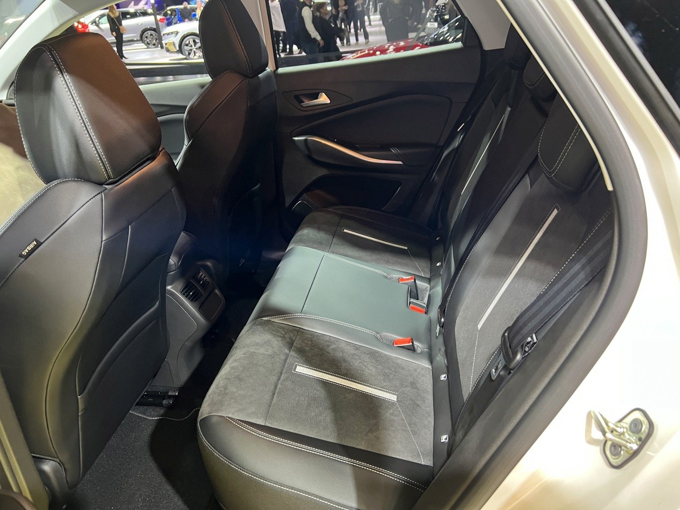 Rear passenger seats with premium upholstery and modern styling