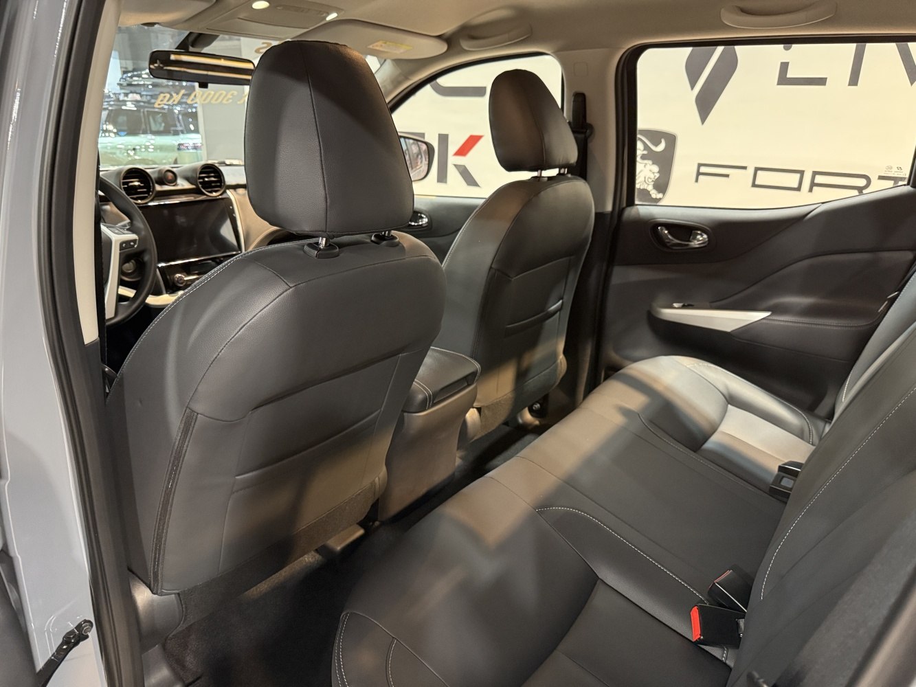 Rear seating and front dashboard view with leather upholstery