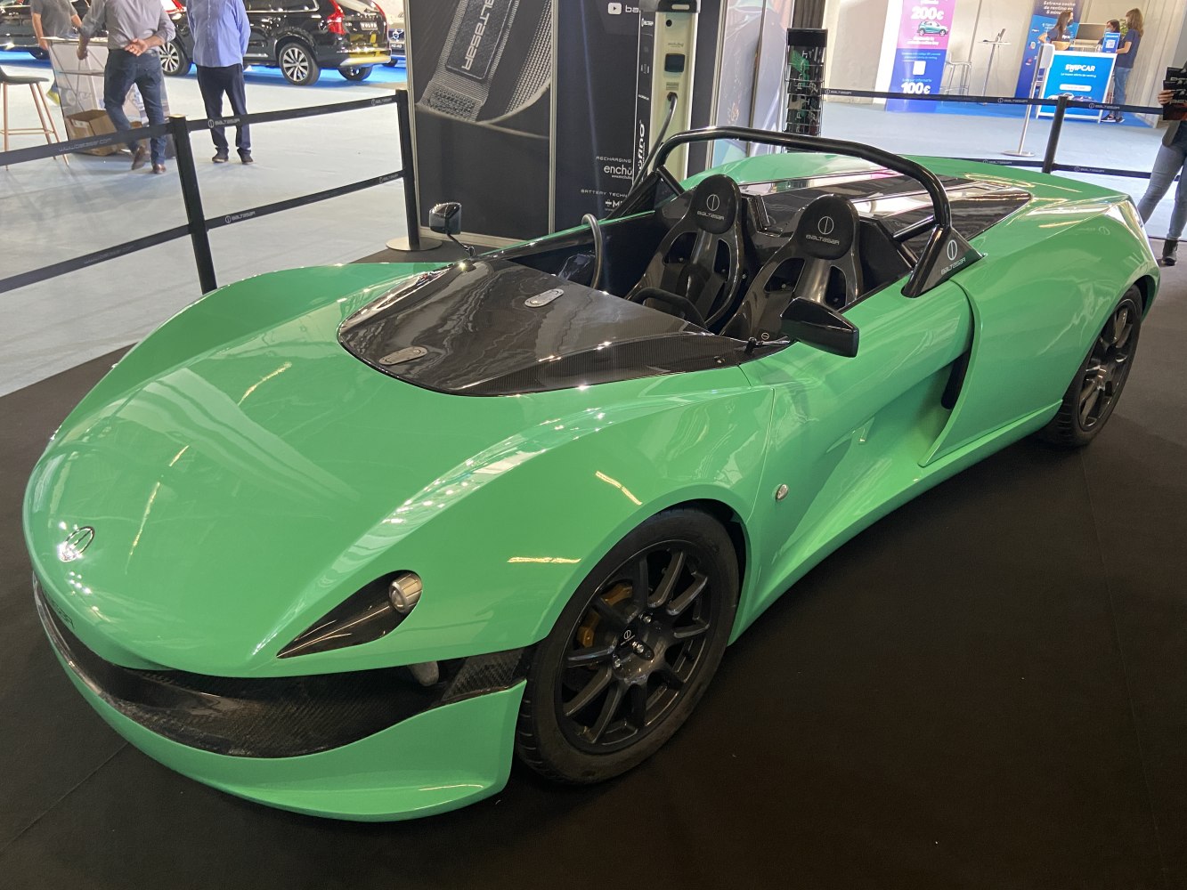 Lightweight open-top roadster with carbon fiber hood and sporty seats