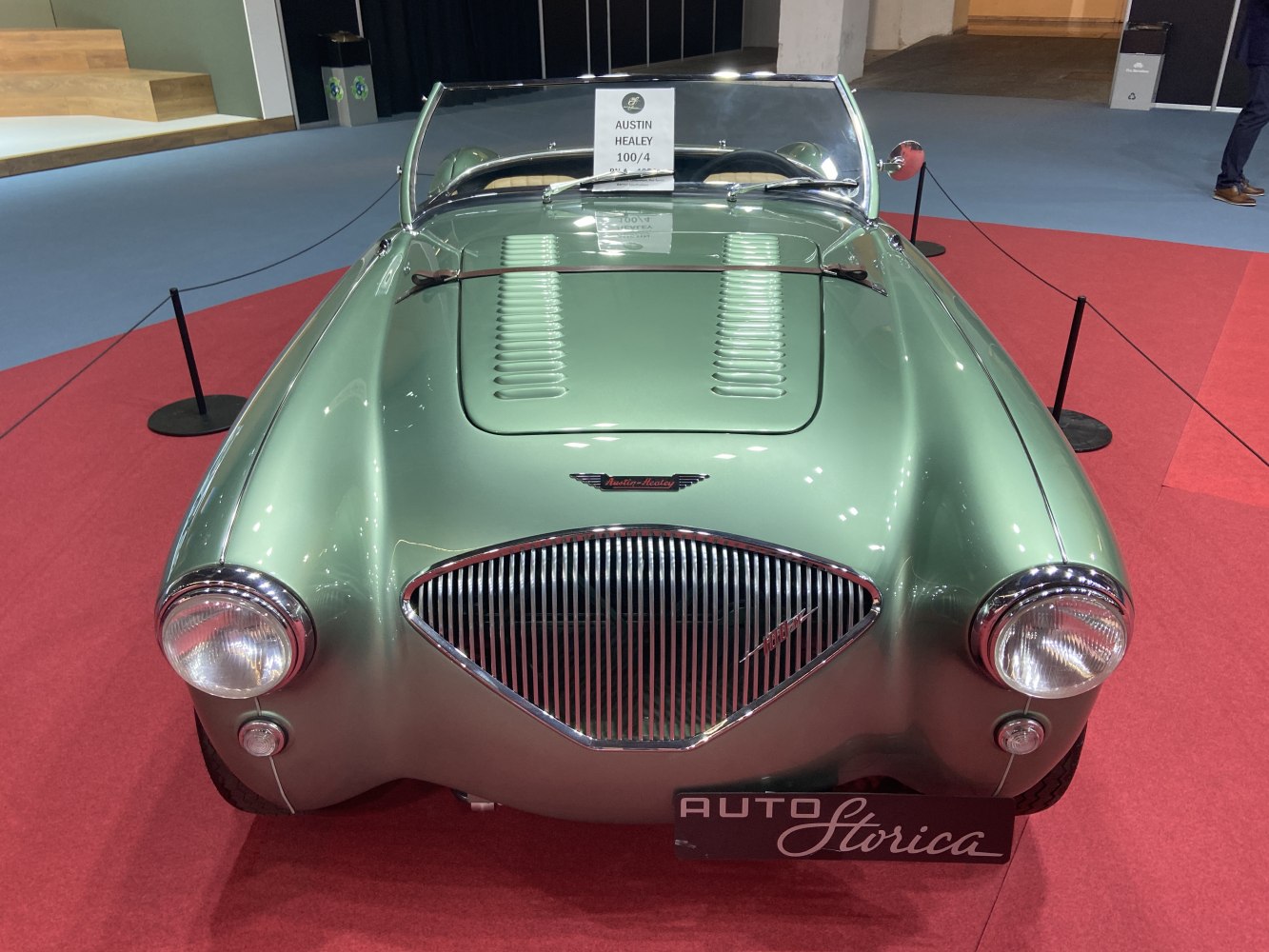 Classic front view with iconic grille and hood vents of vintage roadster