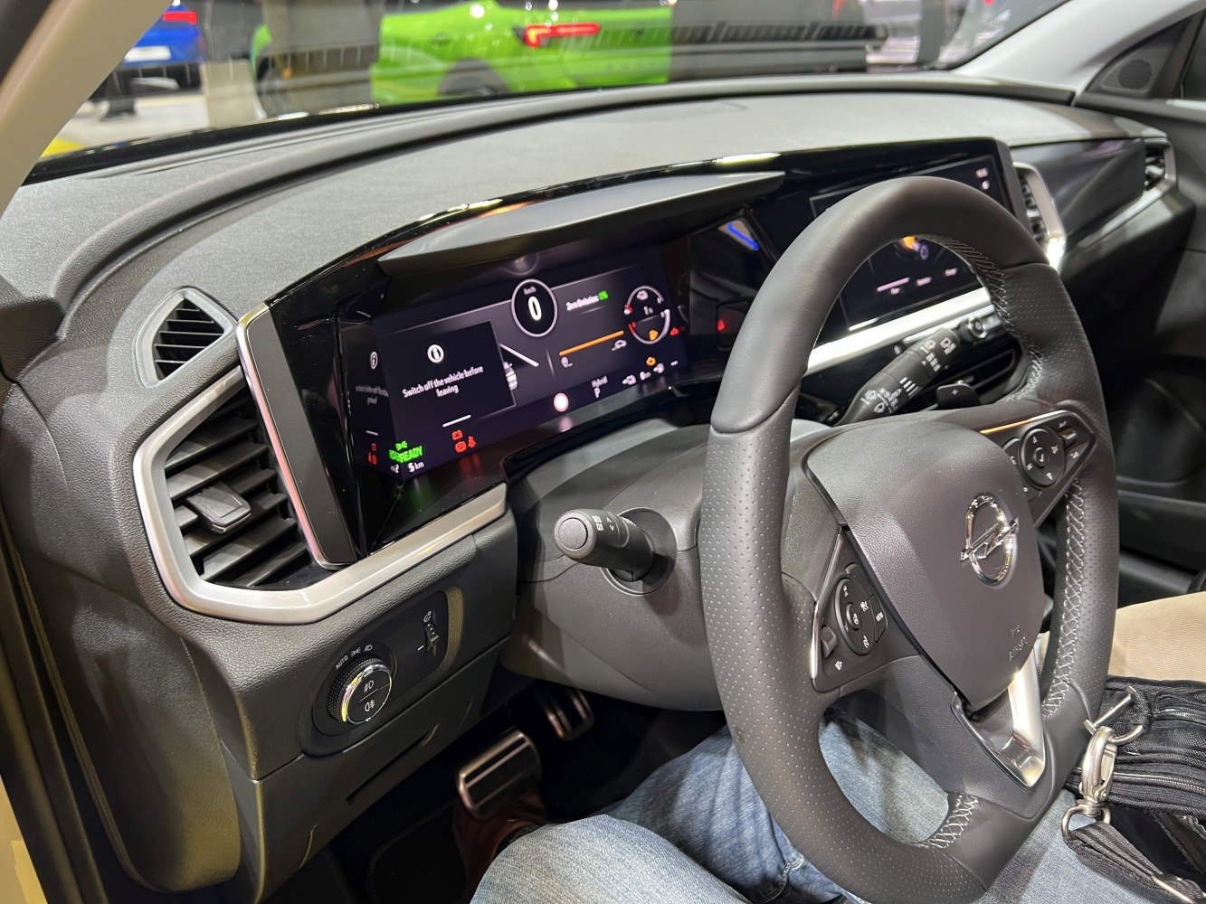 Digital instrument cluster and multifunction steering wheel in modern vehicle interior