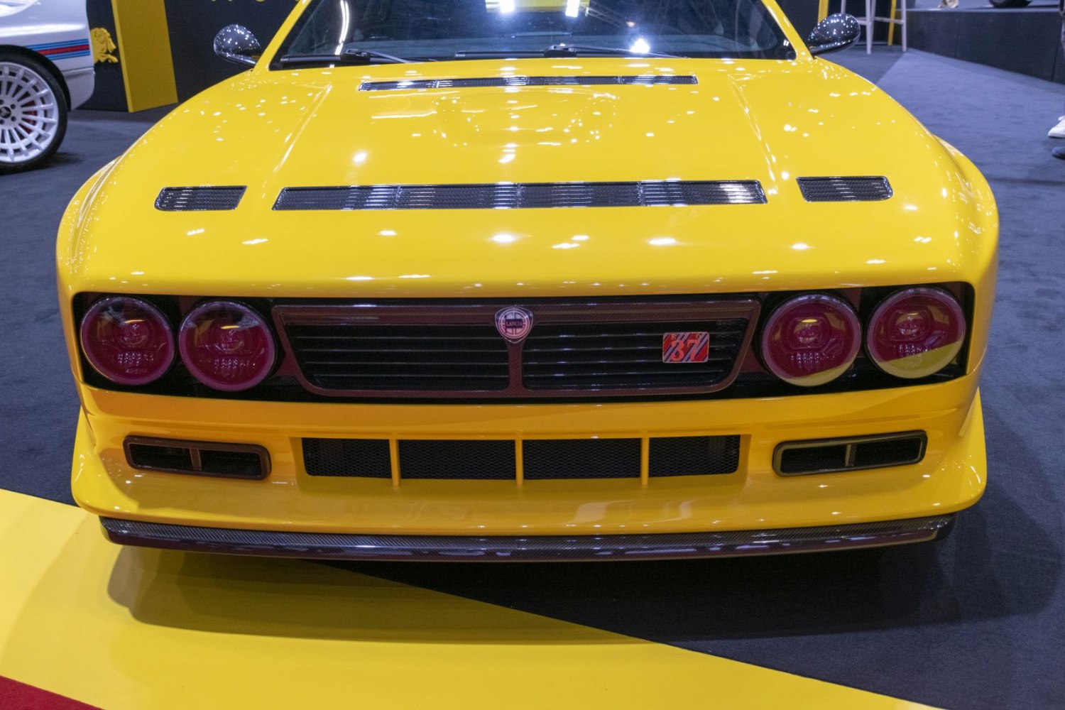 Front end with quad round headlights and black front grille.