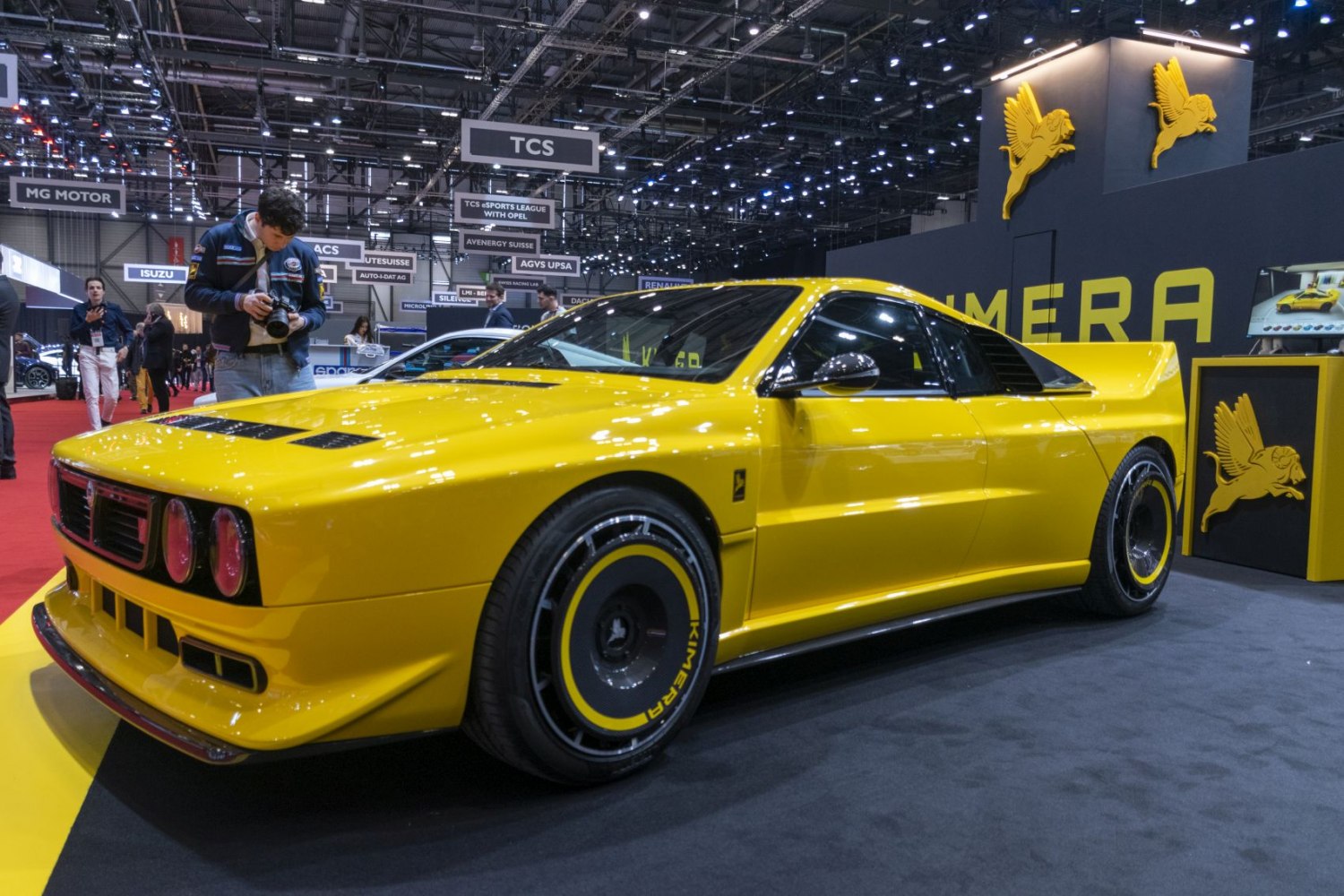 Yellow low-slung sports coupe with wide body and custom wheels