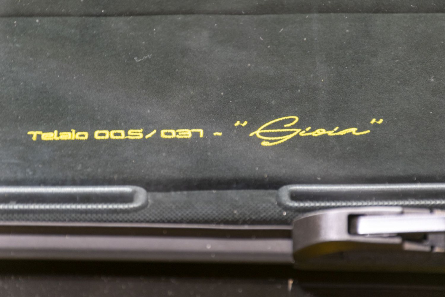 Yellow embroidered limited edition chassis number on black interior