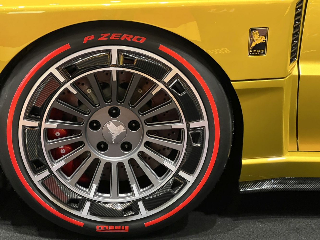Close-up of alloy wheel with carbon fiber and Pirelli P Zero tire