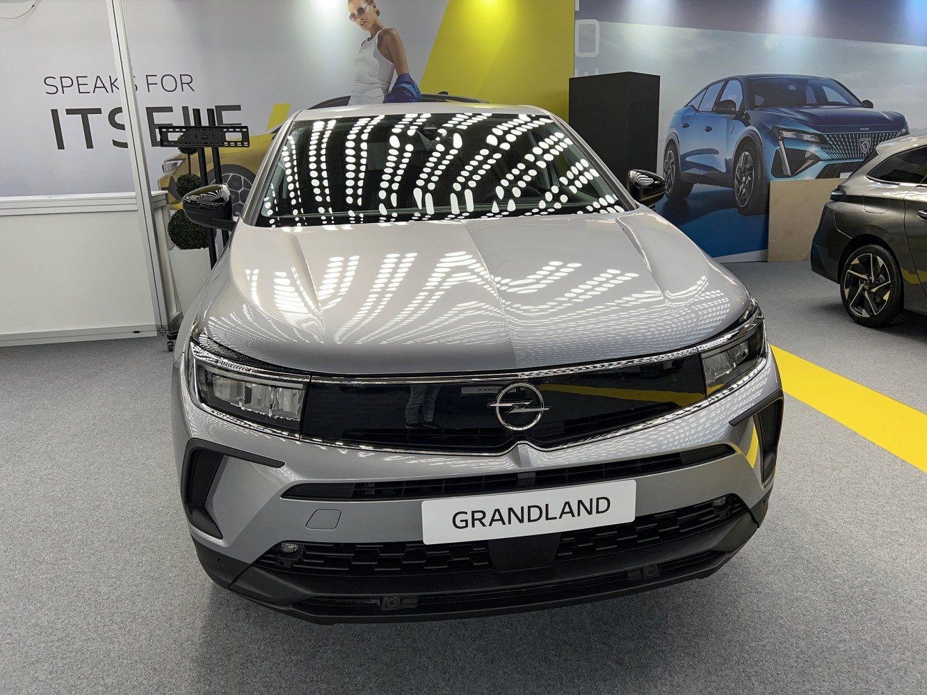 Front view of modern SUV with sleek headlights and distinctive grille