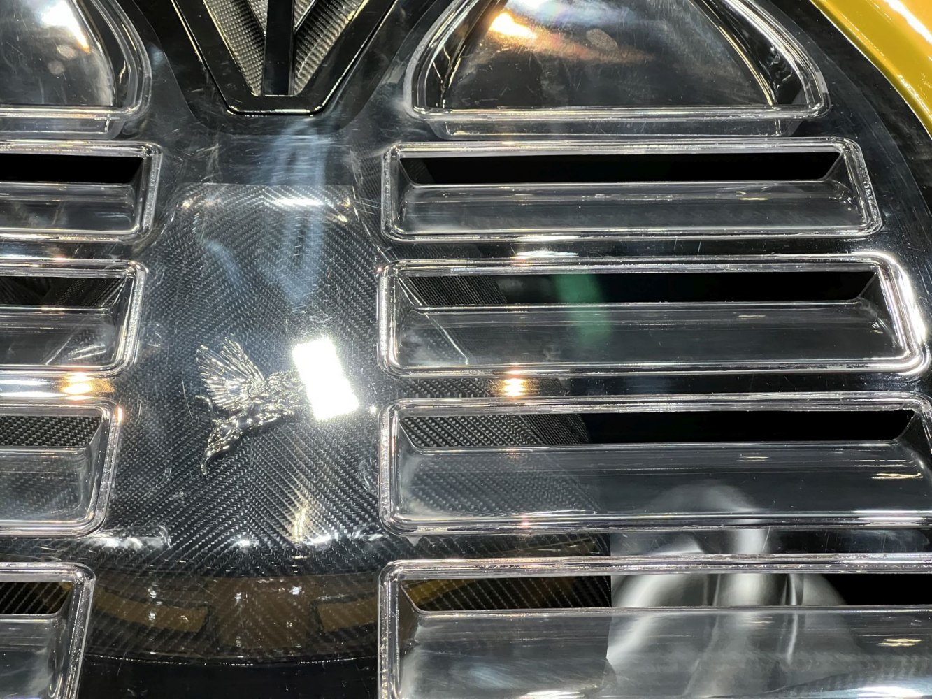 Carbon fiber rear deck with air vents and Pegasus emblem