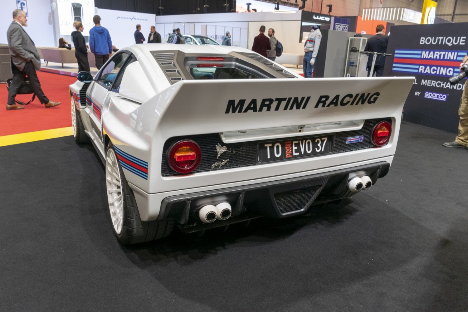 Rear view with Martini Racing stripes and large rear wing spoiler
