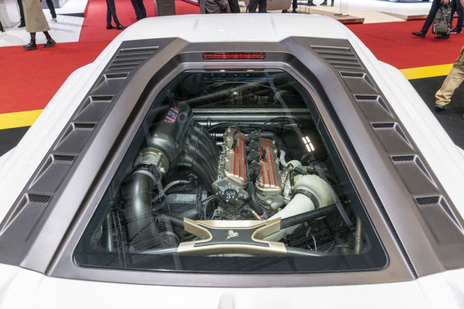 High-performance mid-engine with carbon fiber details and ventilation vents