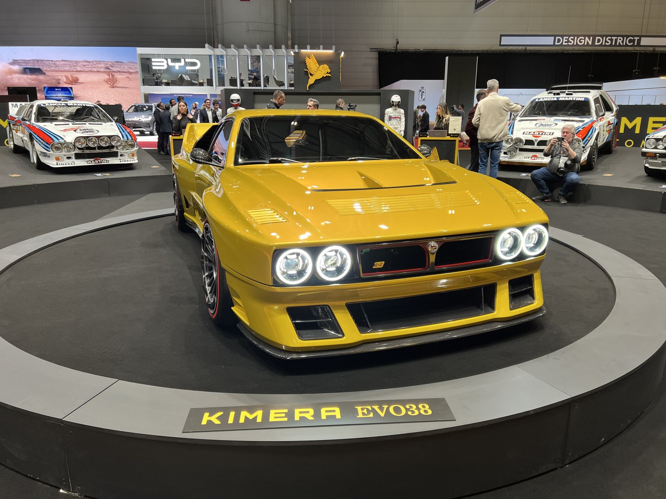 Front view showing quad round LED headlights and aggressive aerodynamic styling.