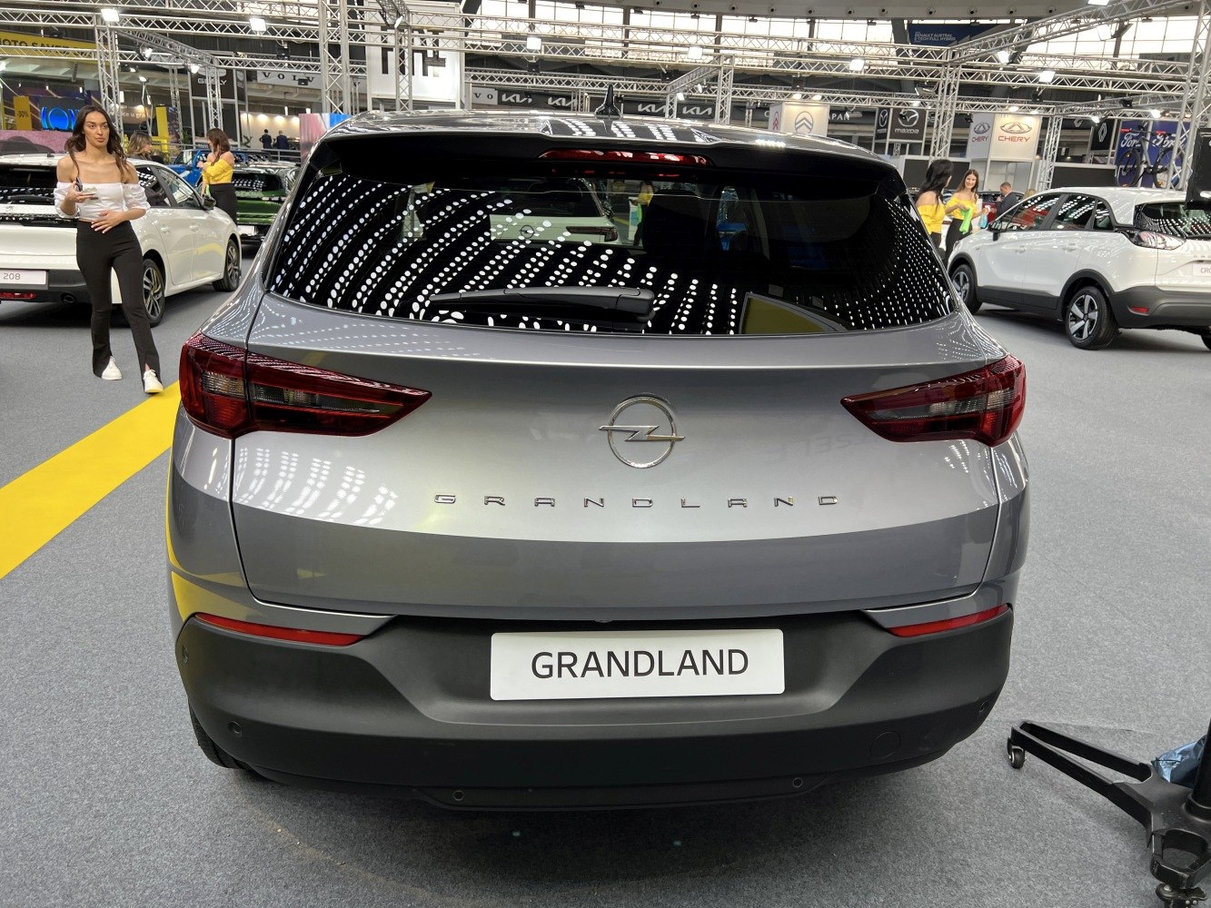 Rear view of modern SUV with sleek taillights and badge