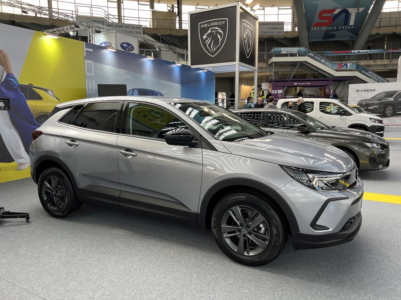 Silver SUV with modern LED headlights and alloy wheels