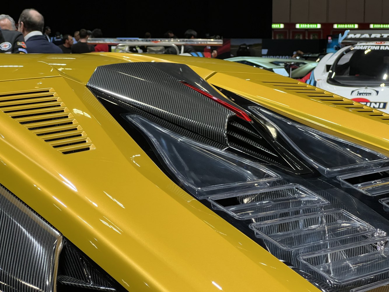 Carbon fiber rear engine cover with aerodynamic vents