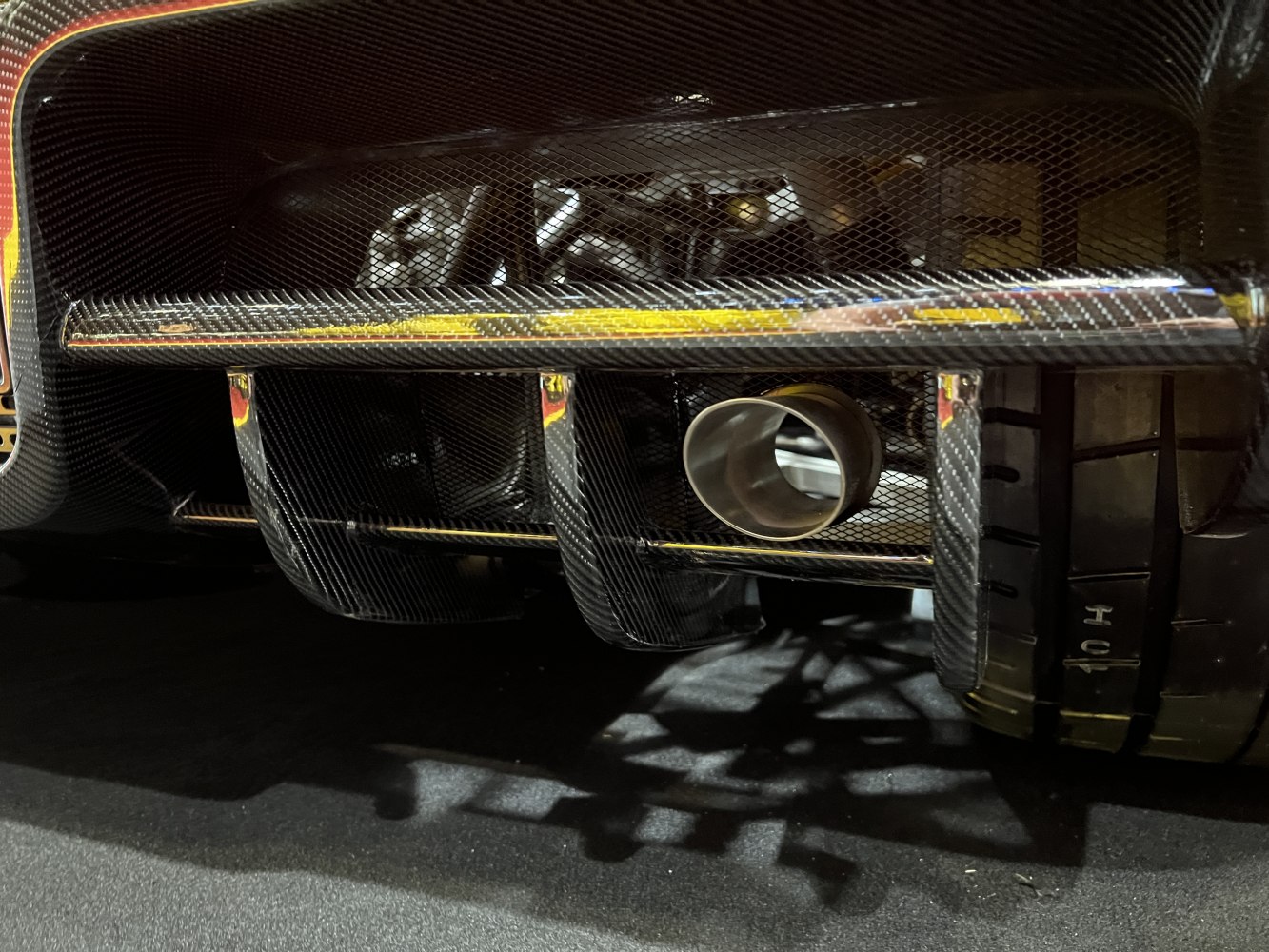 Carbon fiber diffuser with racing exhaust and slick tire tread