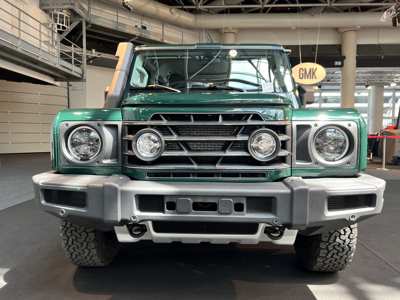 Rugged front grille and round headlights with off-road bumper