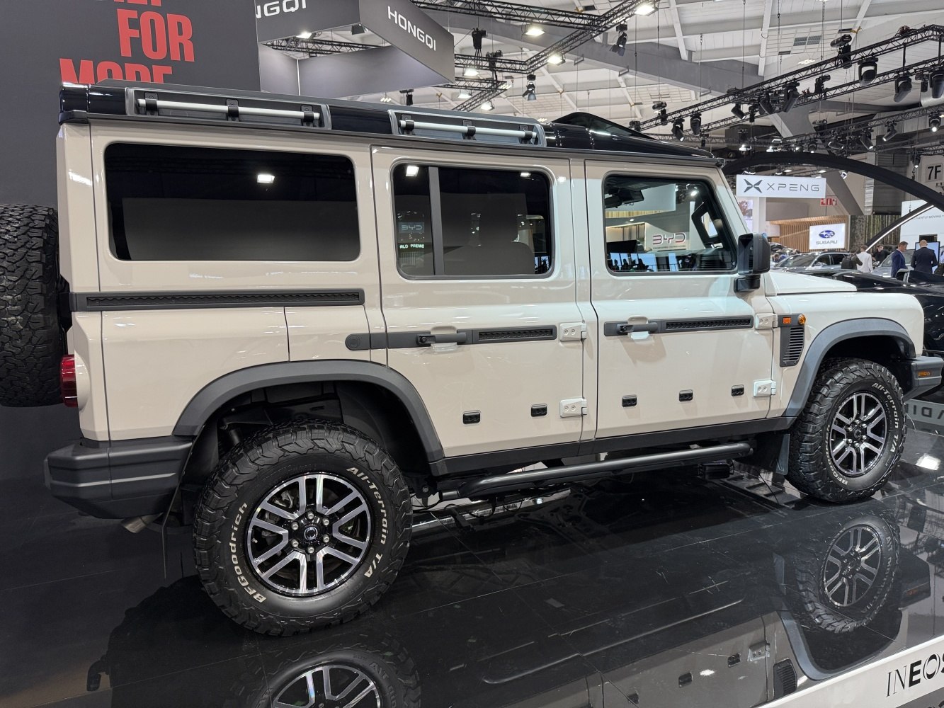 Rugged 4-door SUV with roof rack and all-terrain tires