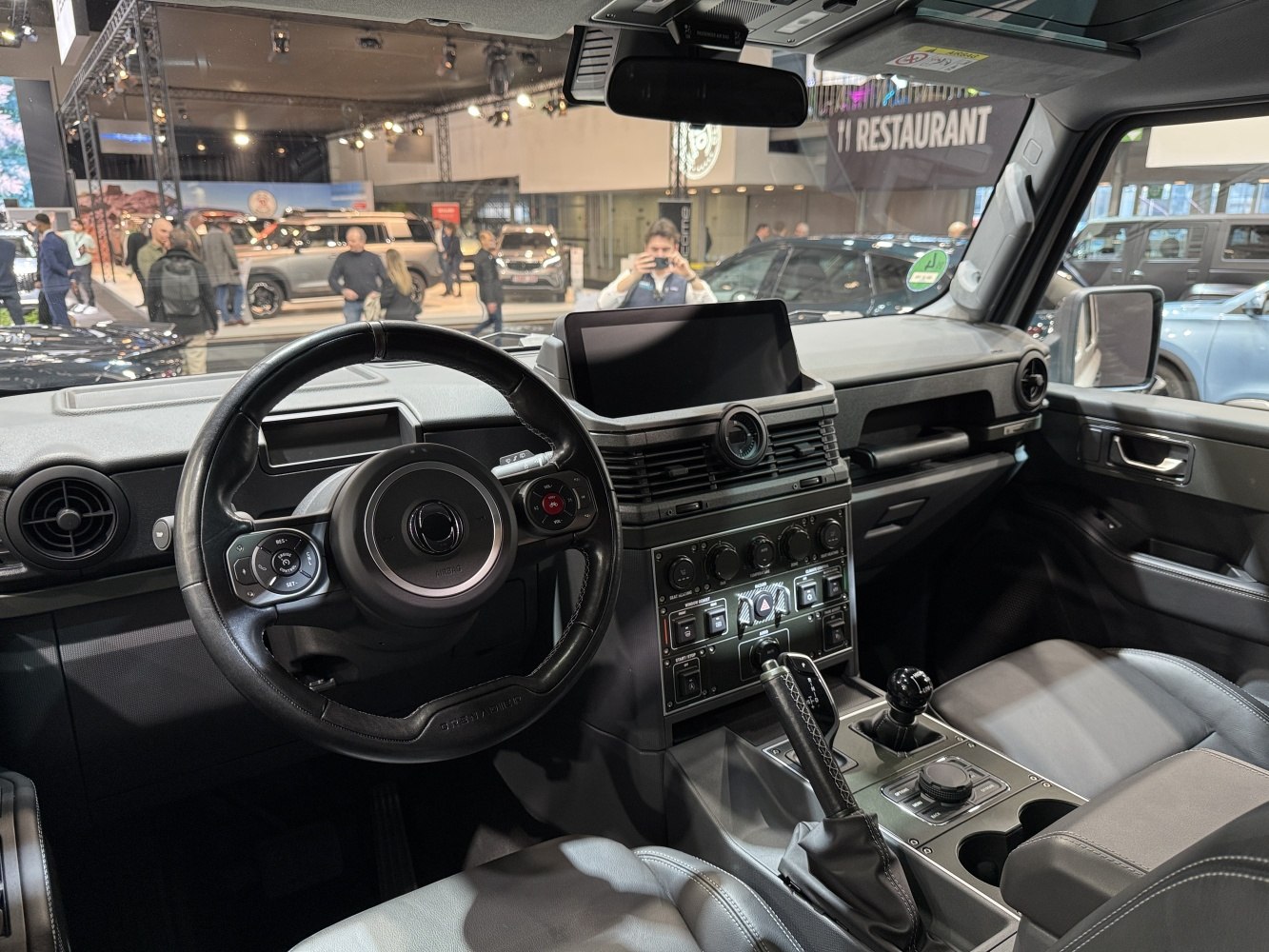 Steering wheel, dashboard, manual gear shifter, center console controls