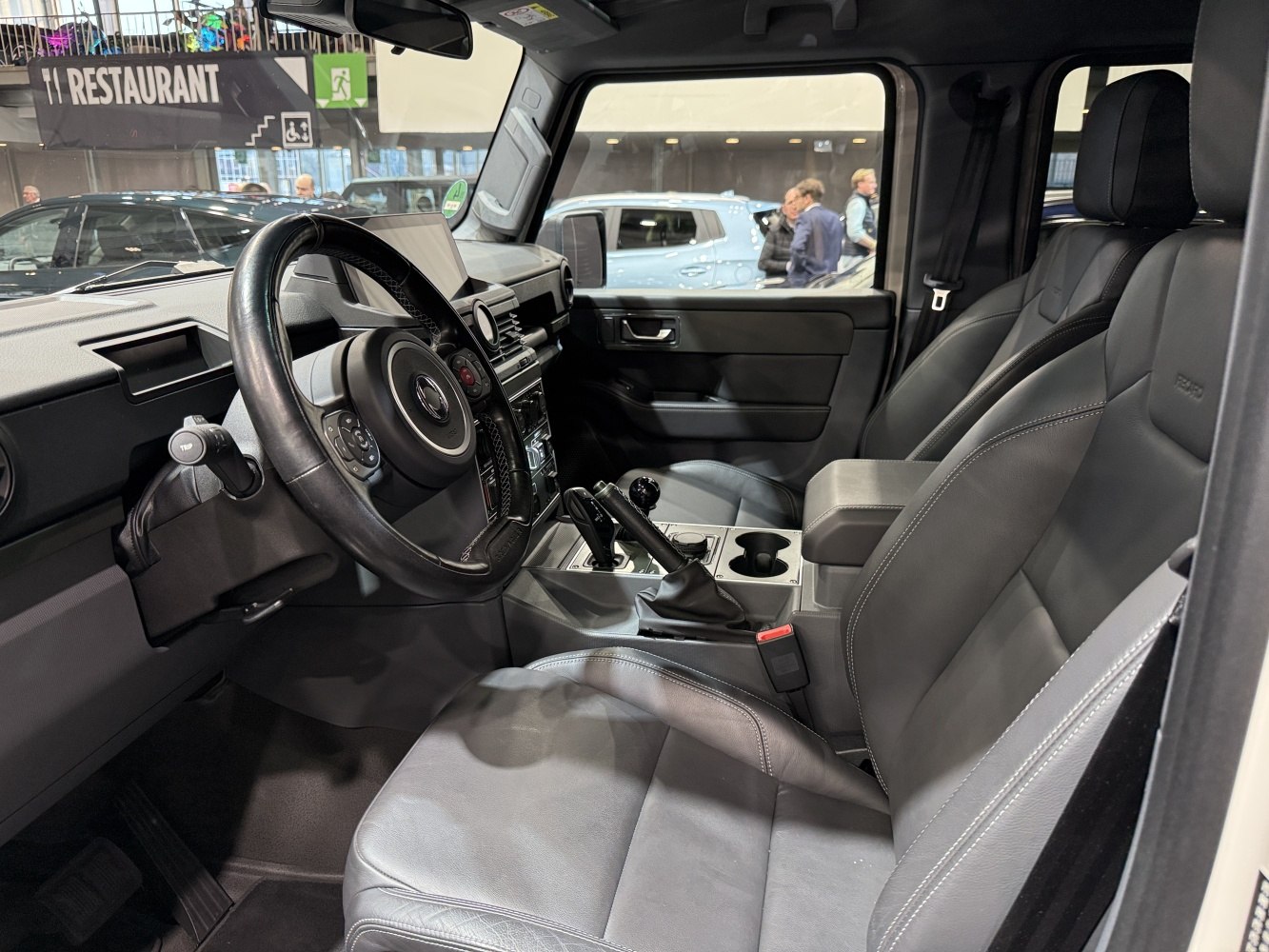 Rugged SUV interior with leather seats and manual gear shift
