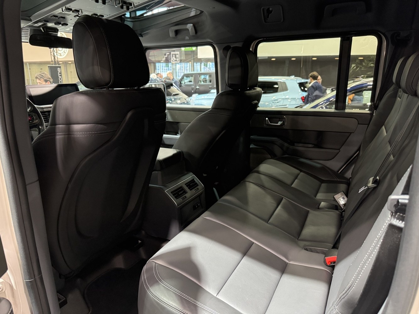 Spacious black leather rear seats with headrests and rear air vents