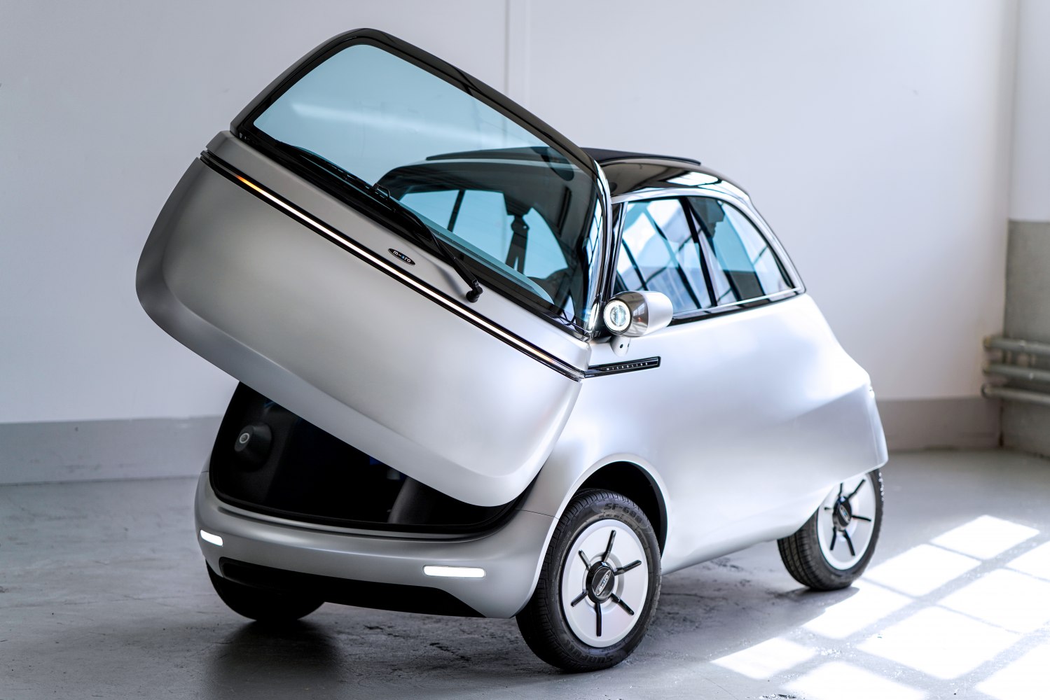 Compact electric vehicle with unique front-opening door design