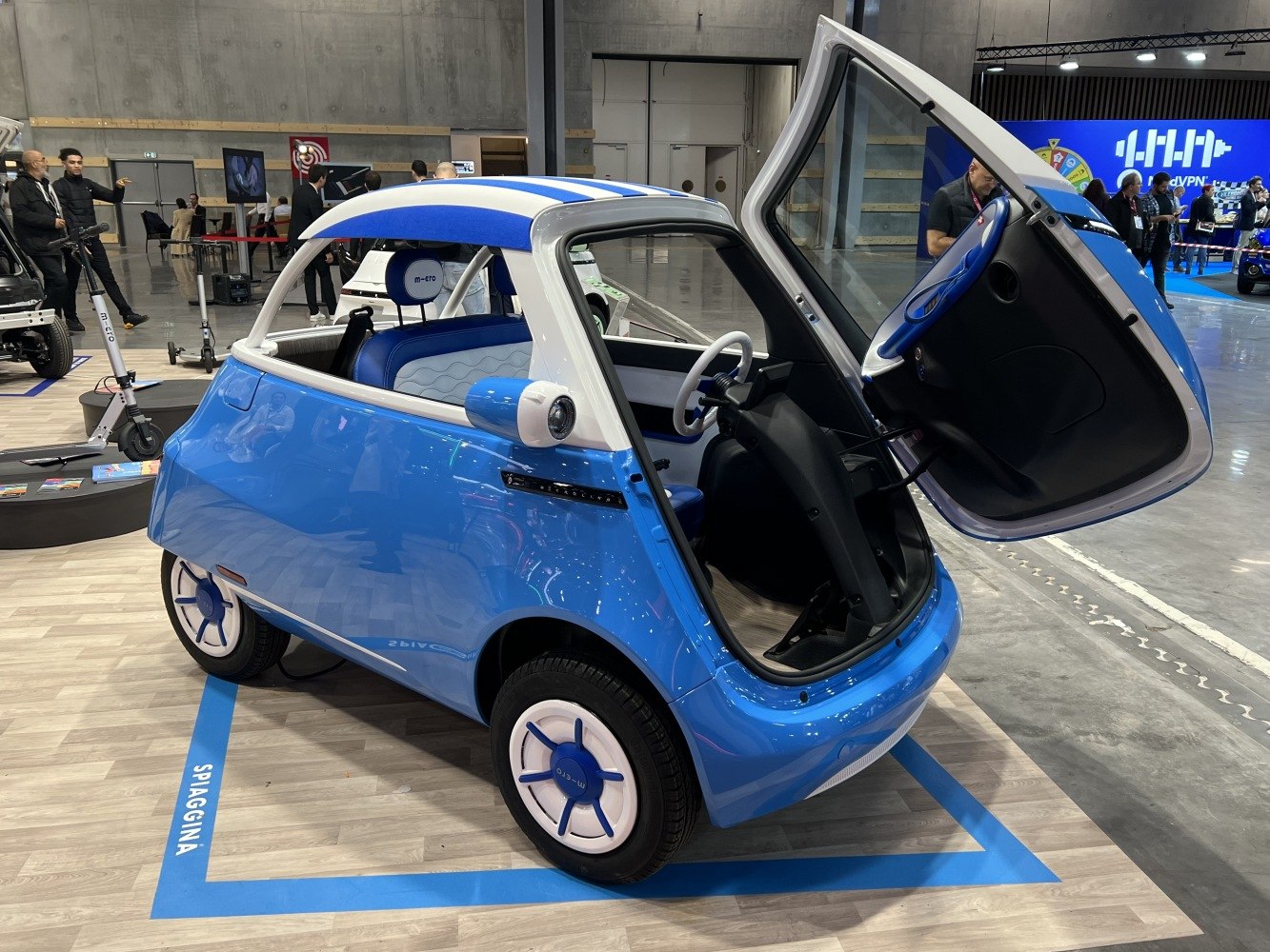 Compact microcar with distinctive front-opening door and retro styling