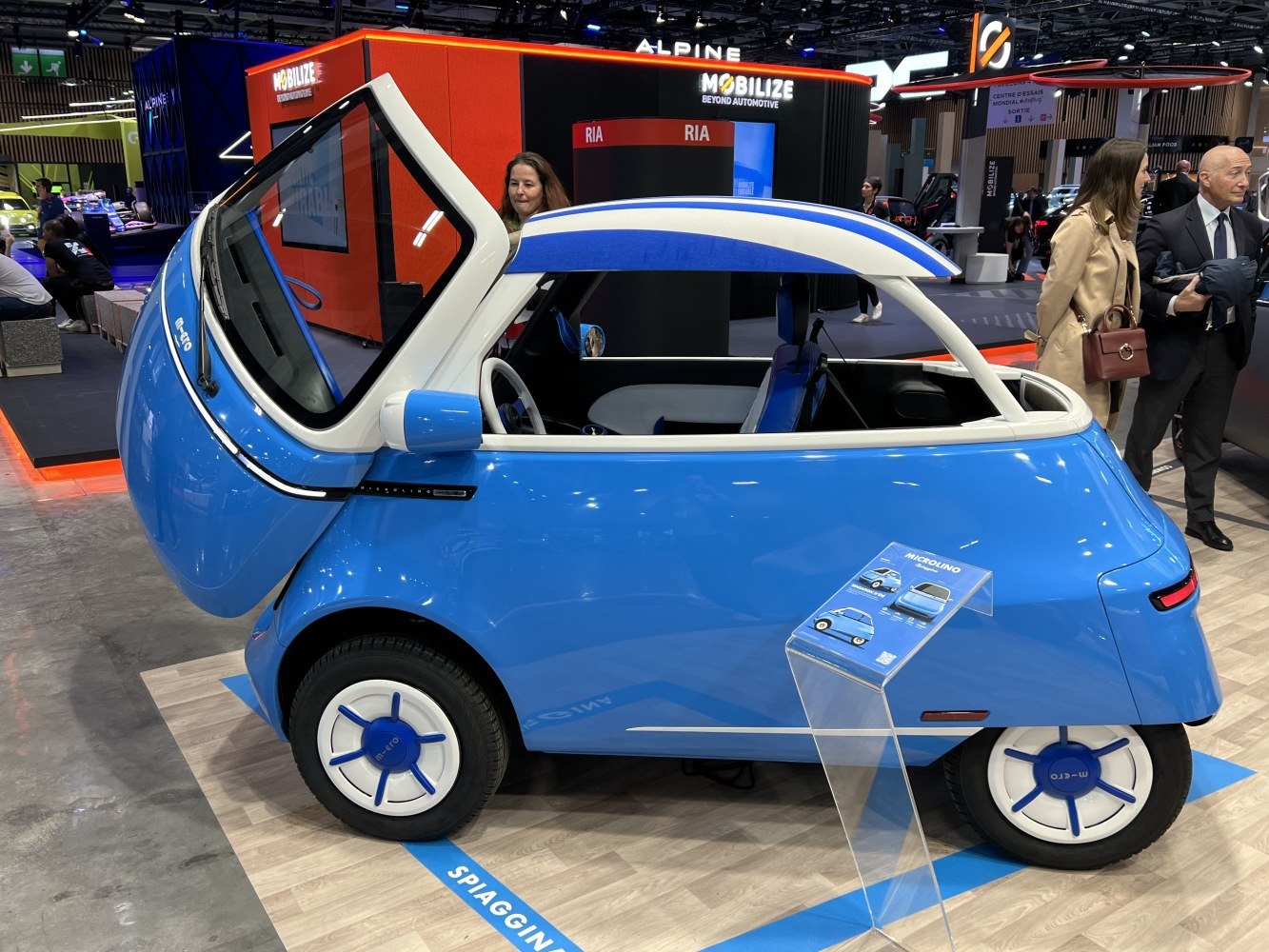 Compact microcar with front-opening door and retro-modern design