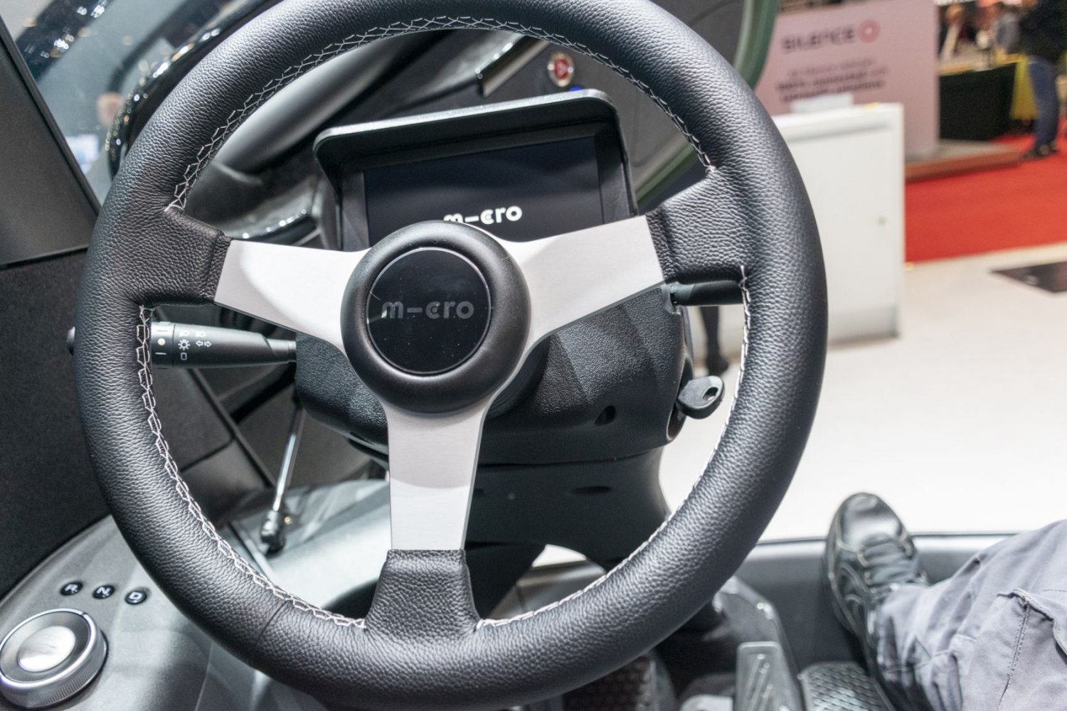 Close-up of steering wheel and digital dashboard