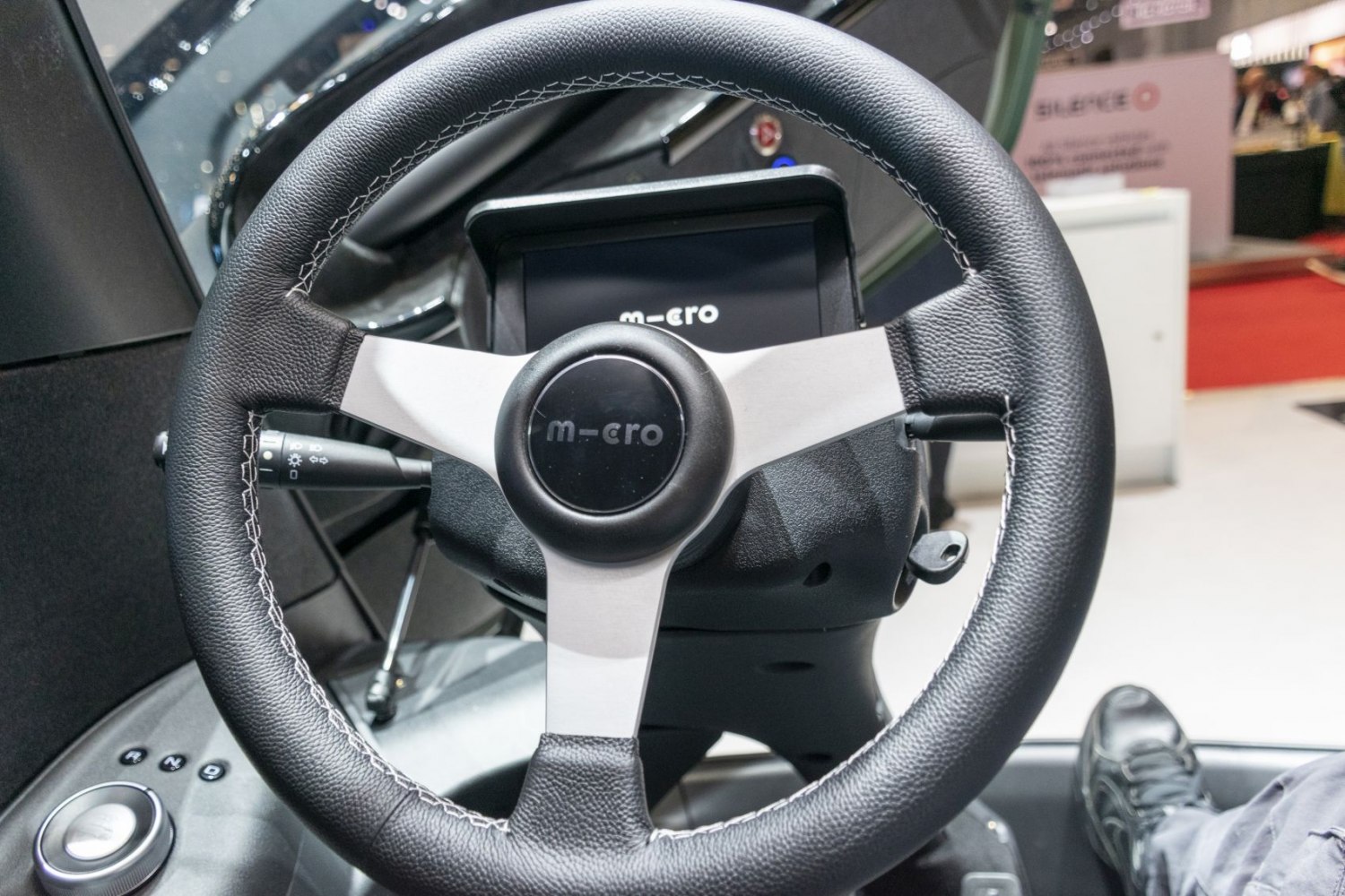 Close-up of steering wheel and dashboard display