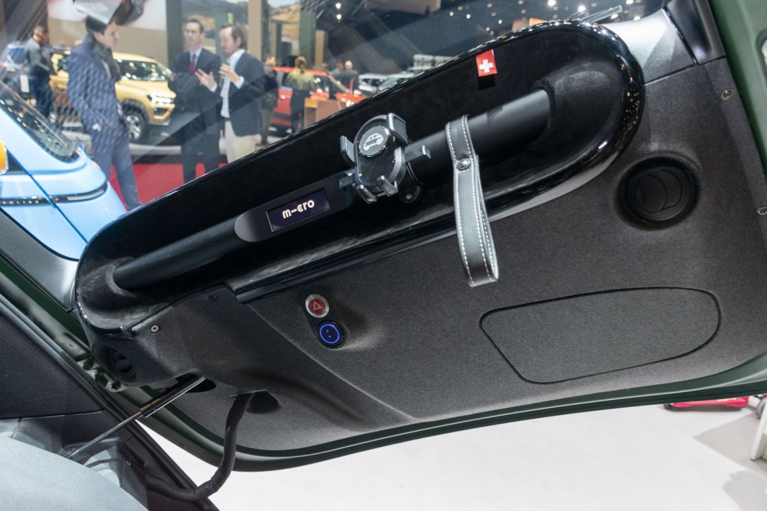Microlino door interior with foldable handle and control buttons